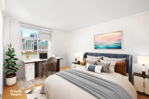 a bed room with furniture and a potted plant