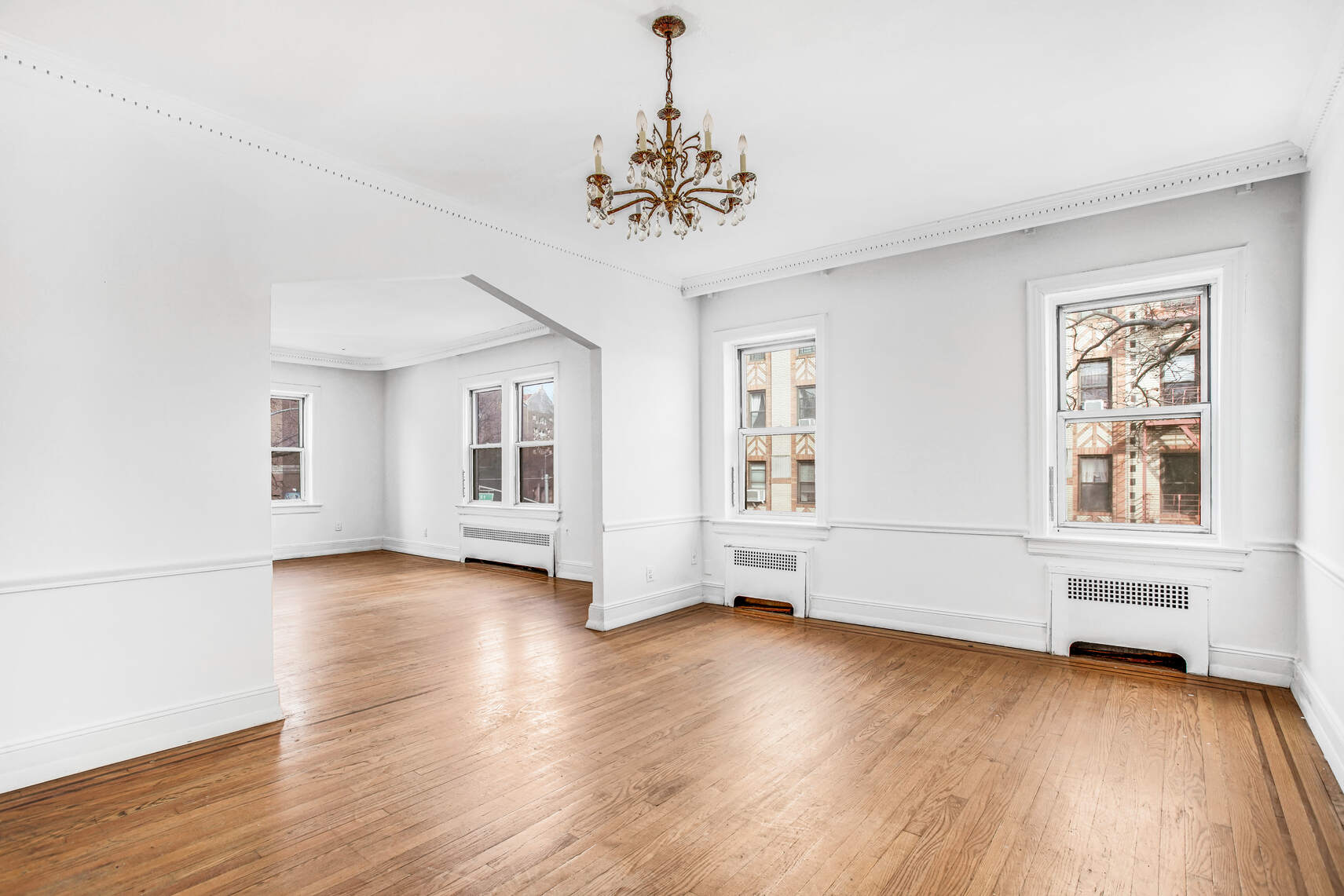 8301 4th Avenue Brooklyn, NY 11209 - Photo 3 of 20 a view of livingroom with hardwood floor and window