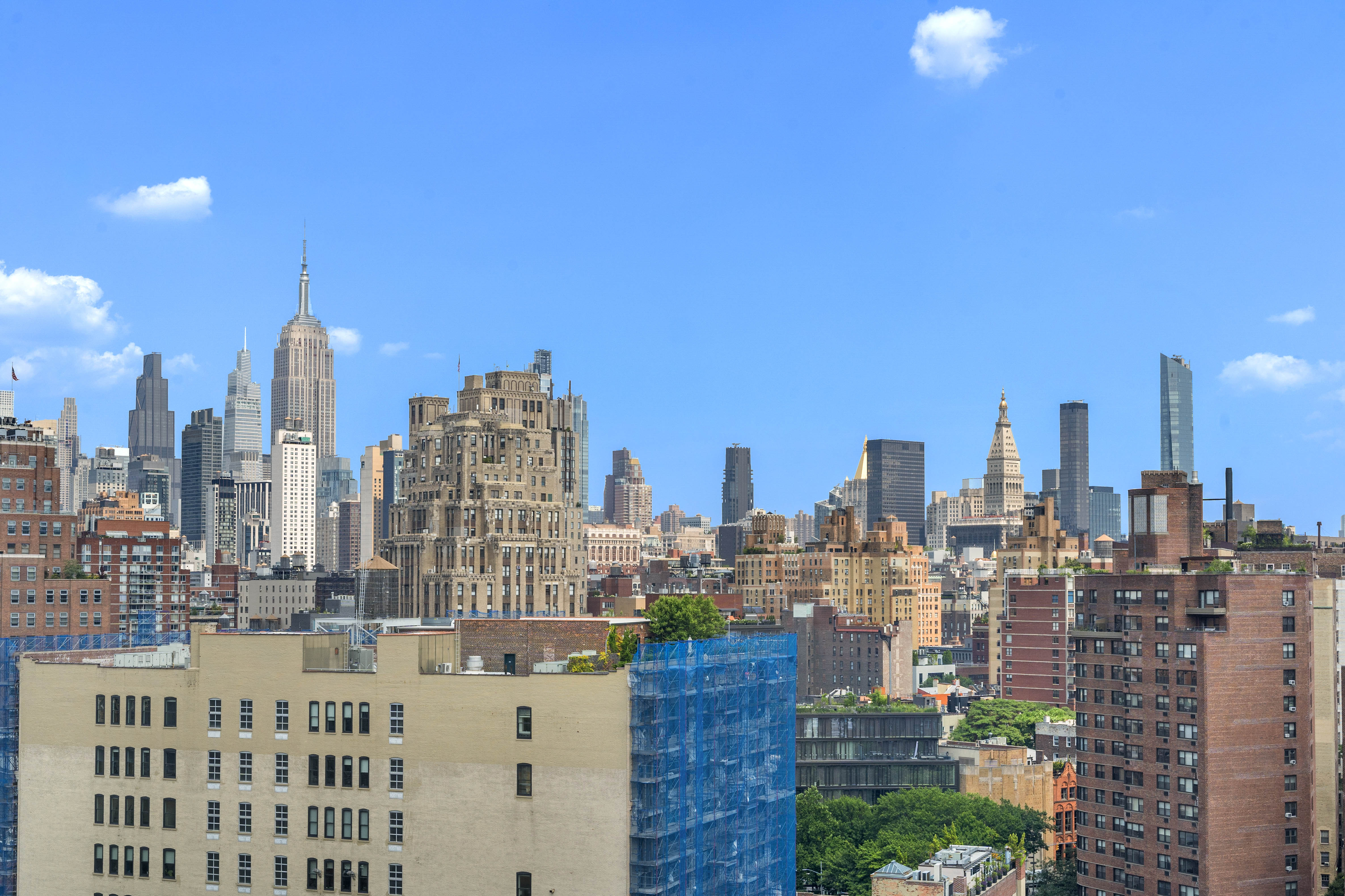 61 Jane Street, Unit 19E Manhattan, NY 10014 - Photo 5 of 9 a view of a city with tall buildings