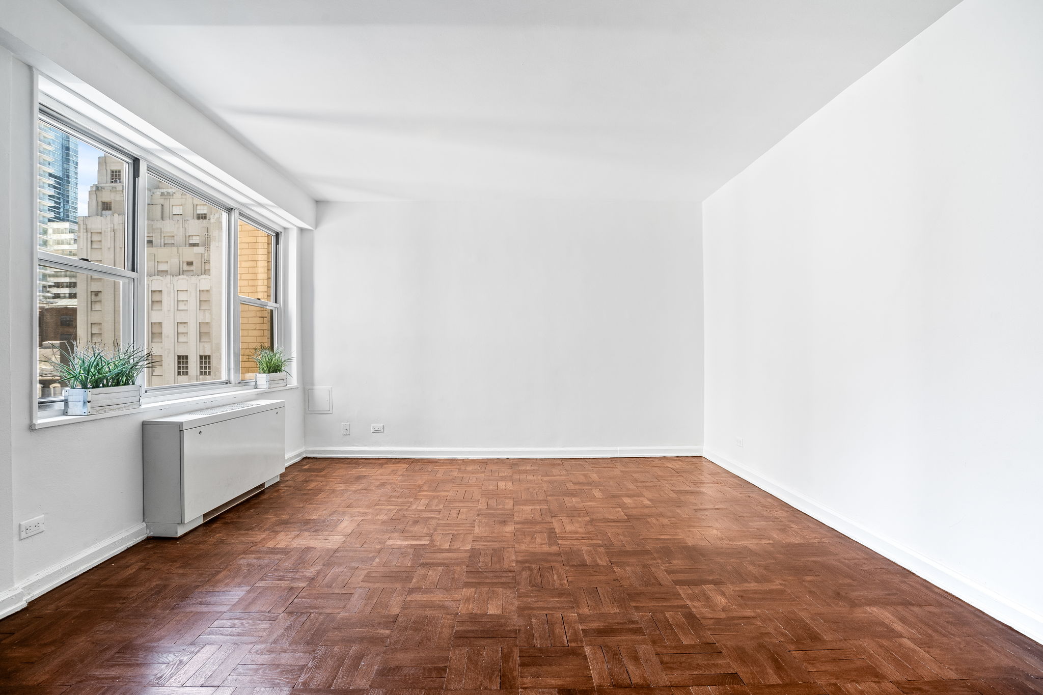 150 East 61st Street, Unit 8B Manhattan, NY 10065 - Photo 4 of 30 a view of an empty room with a window