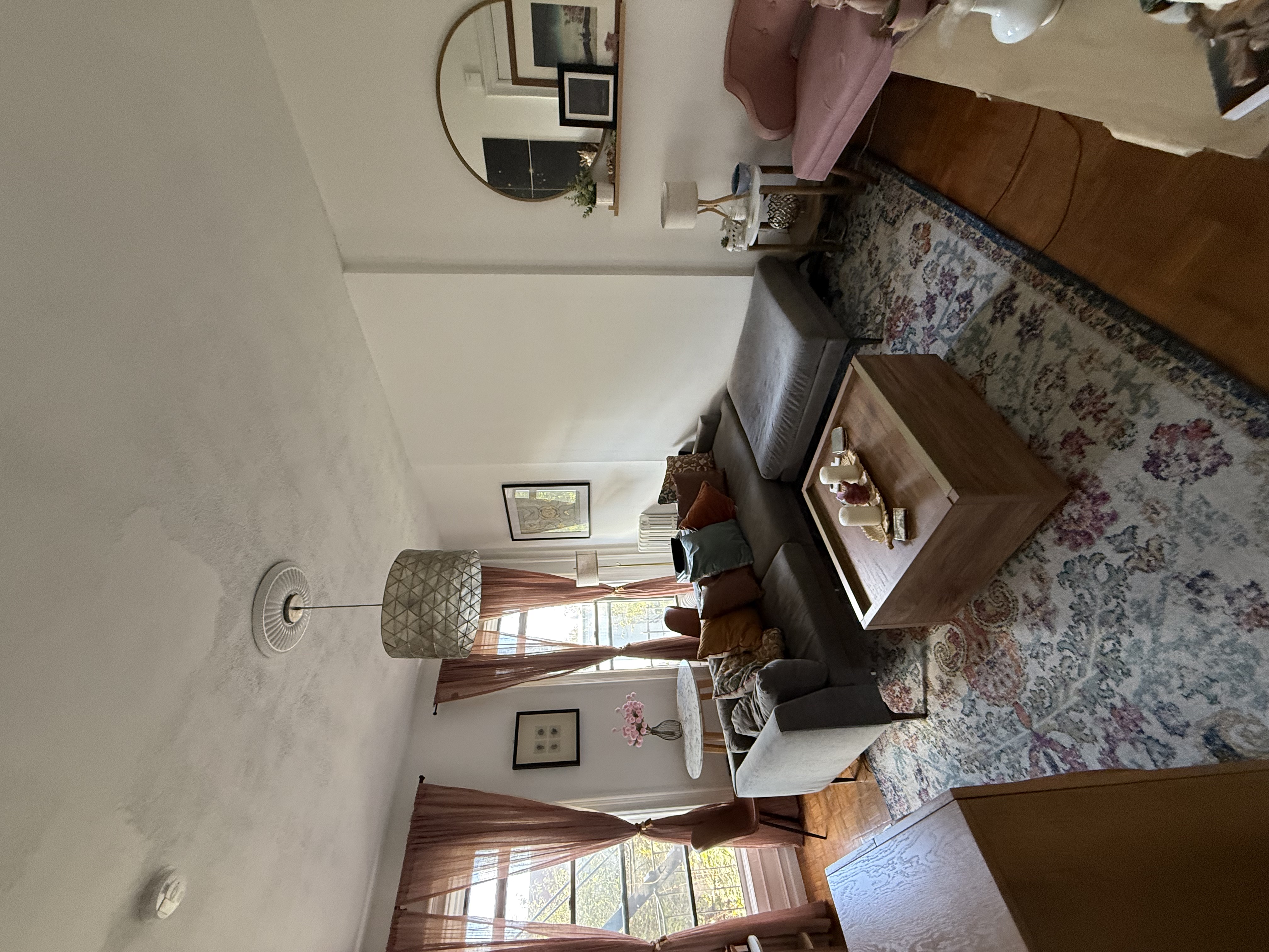 a living room with furniture rug and window