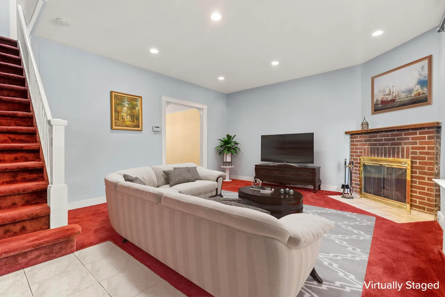 a living room with furniture and a flat screen tv