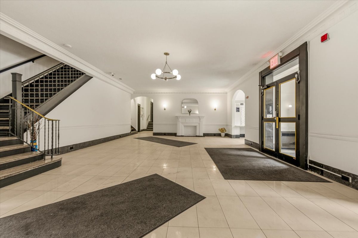 385 Argyle Road, Unit 4A Brooklyn, NY 11218 - Photo 18 of 21 a view of a hallway with a chandelier