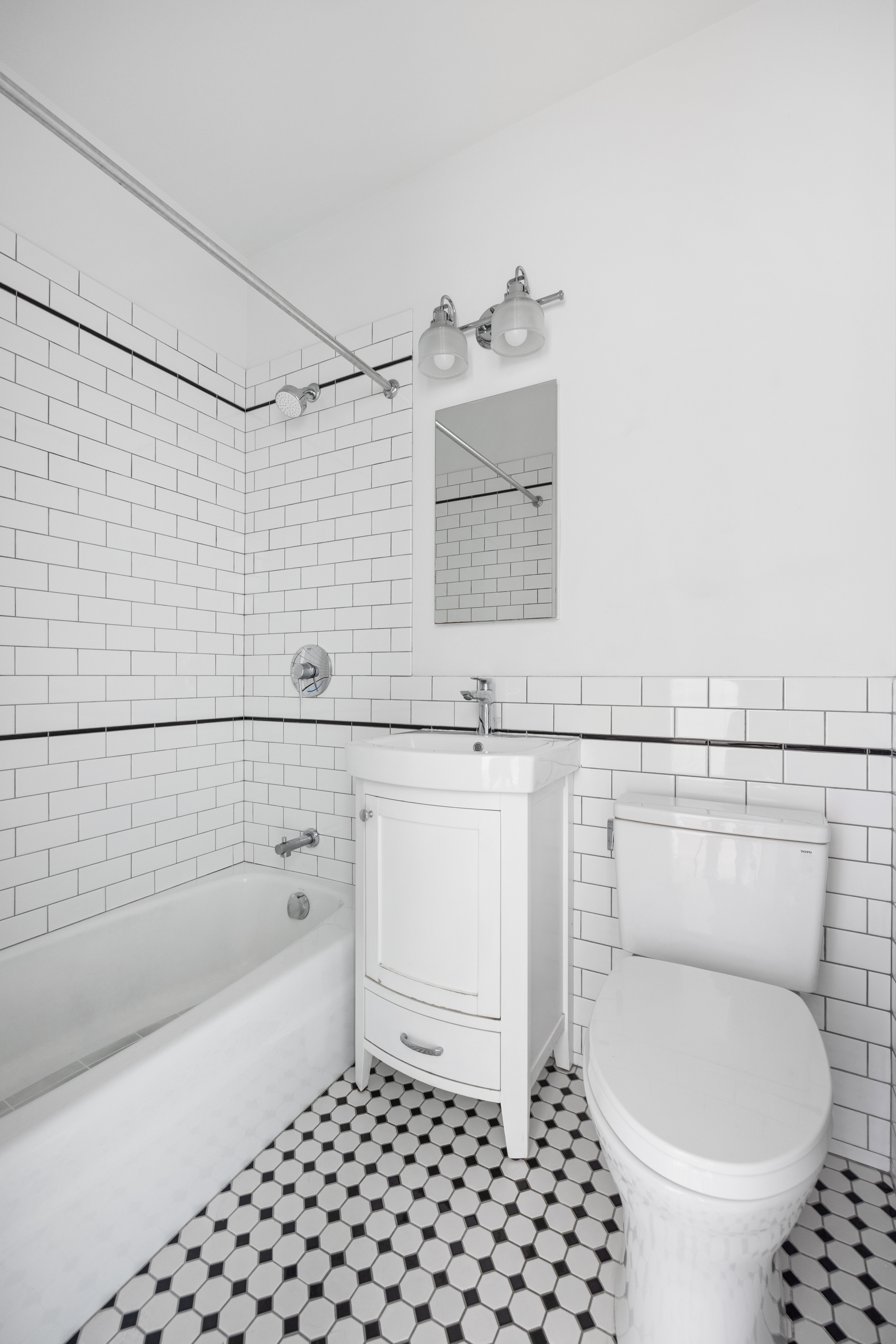 273 Windsor Place Brooklyn, NY 11218 - Photo 15 of 29 a bathroom with a sink toilet and shower