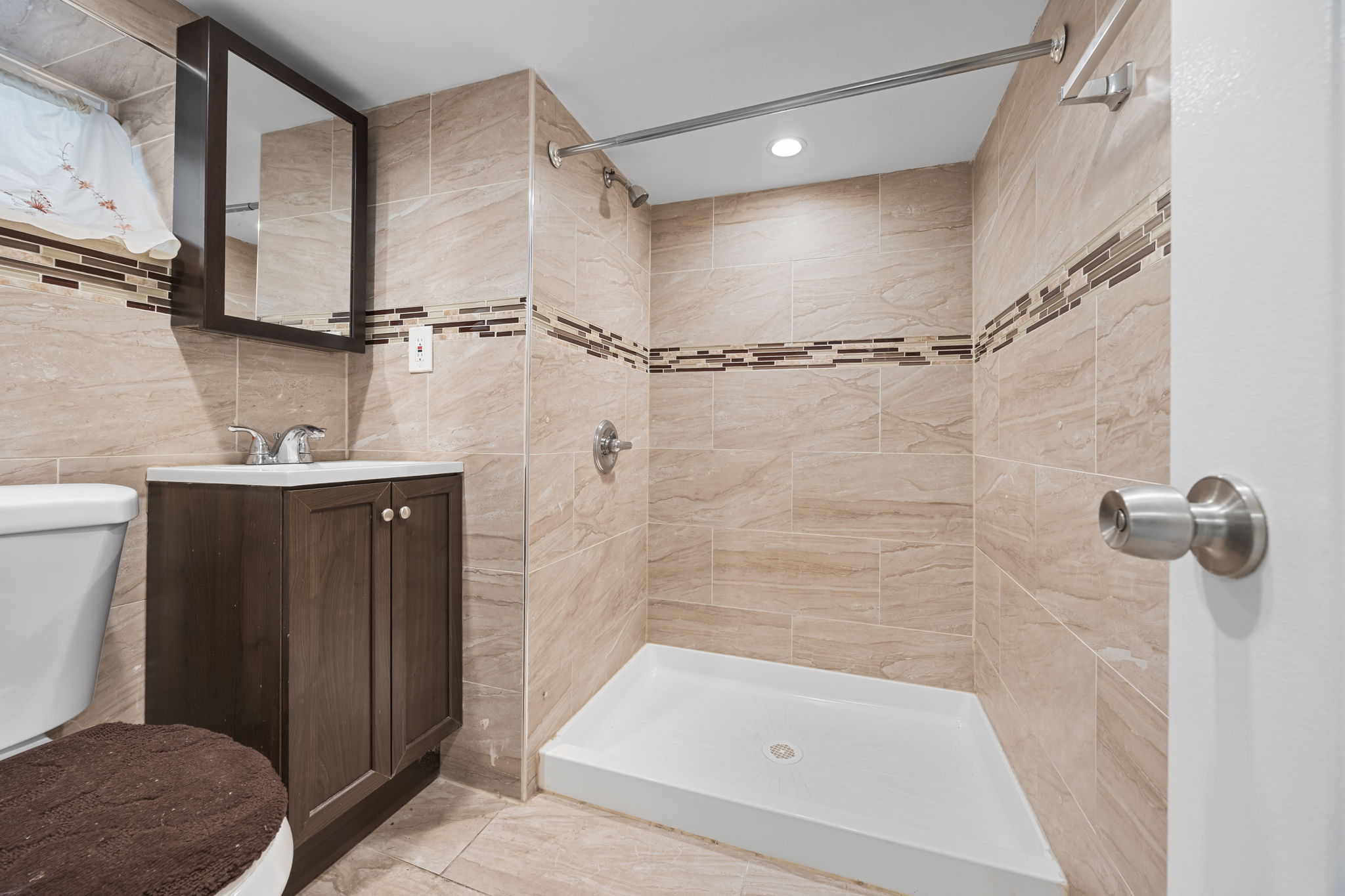 194-35 114th Drive Queens, NY 11412 - Photo 12 of 21 a bathroom with a sink a toilet and shower