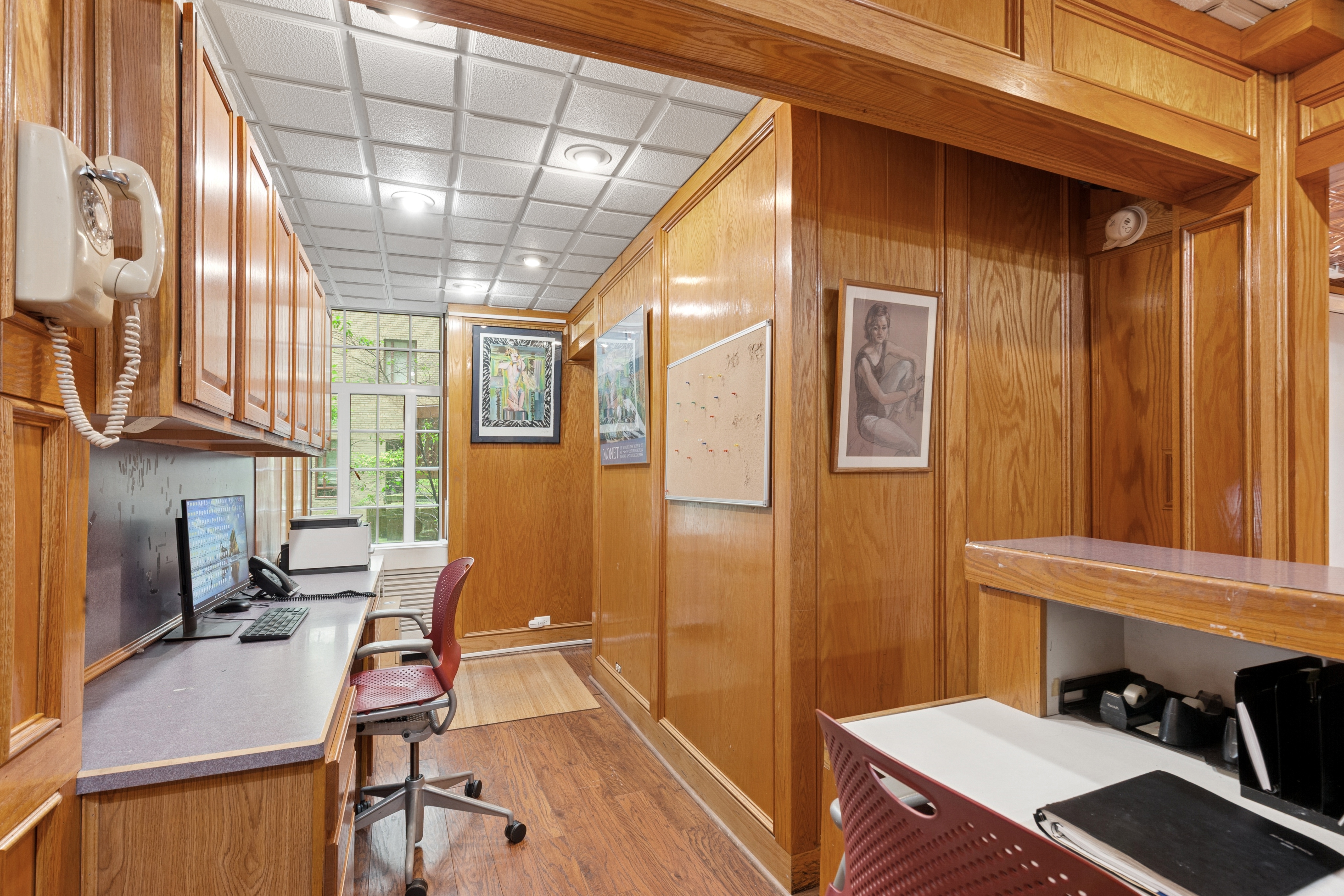 25 Central Park West, Unit 1F Manhattan, NY 10023 - Photo 2 of 8 a workspace with furniture and a window