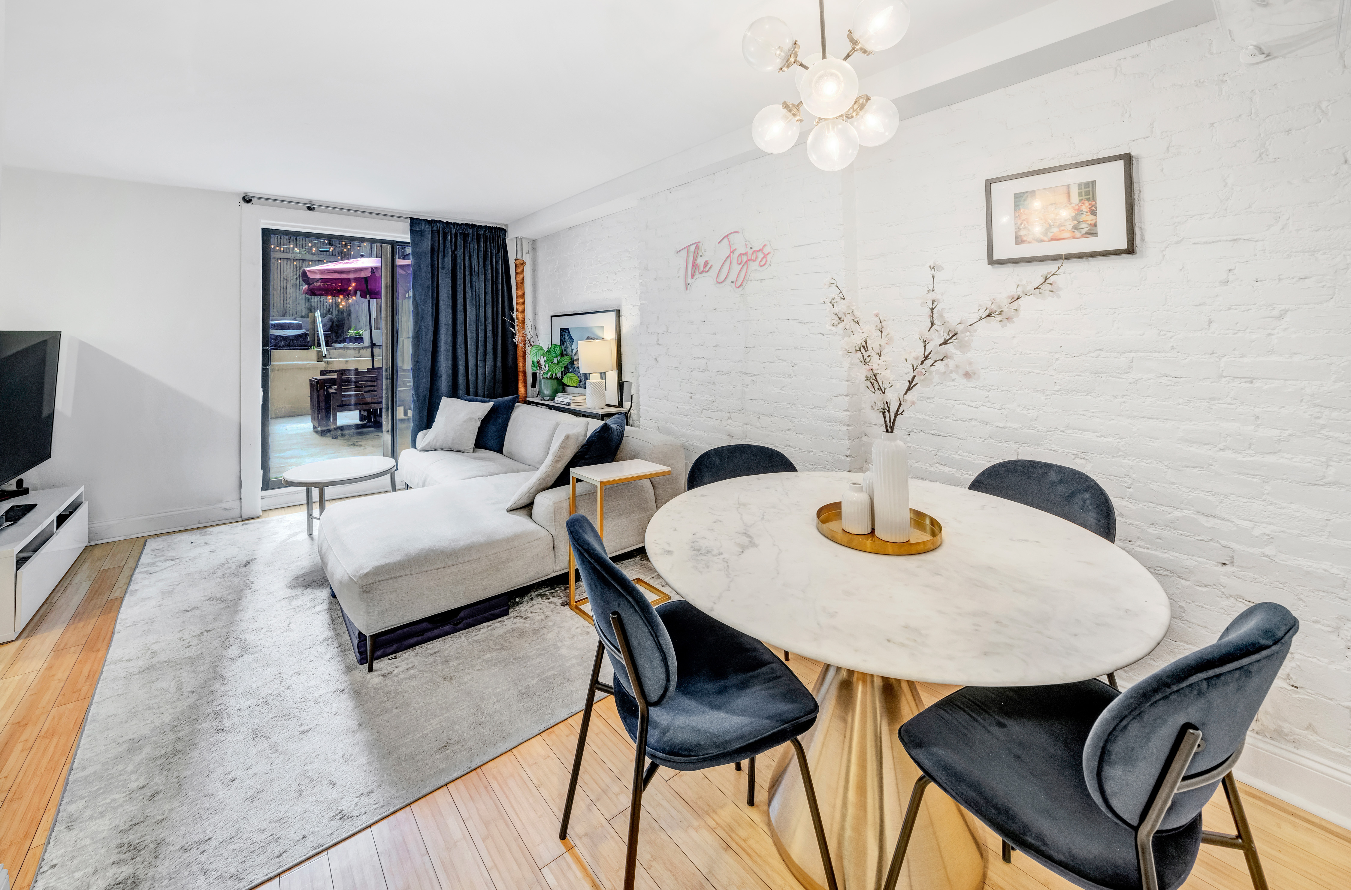 166 West 94th Street, Unit 1 Manhattan, NY 10025 - Photo 2 of 10 a living room with furniture and wooden floor
