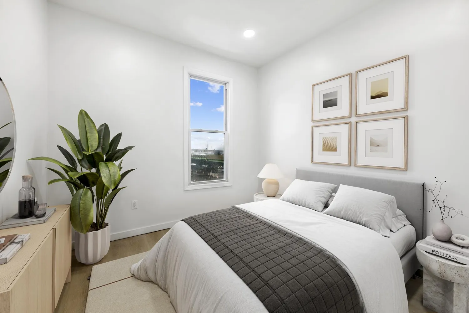 a bedroom with a large bed and a window