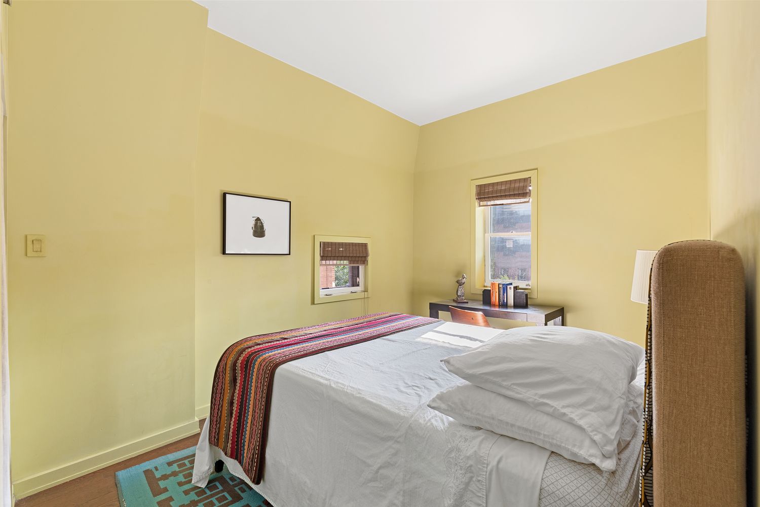 315 Washington Avenue Brooklyn, NY 11205 - Photo 18 of 38 a bedroom with a bed and wooden floor