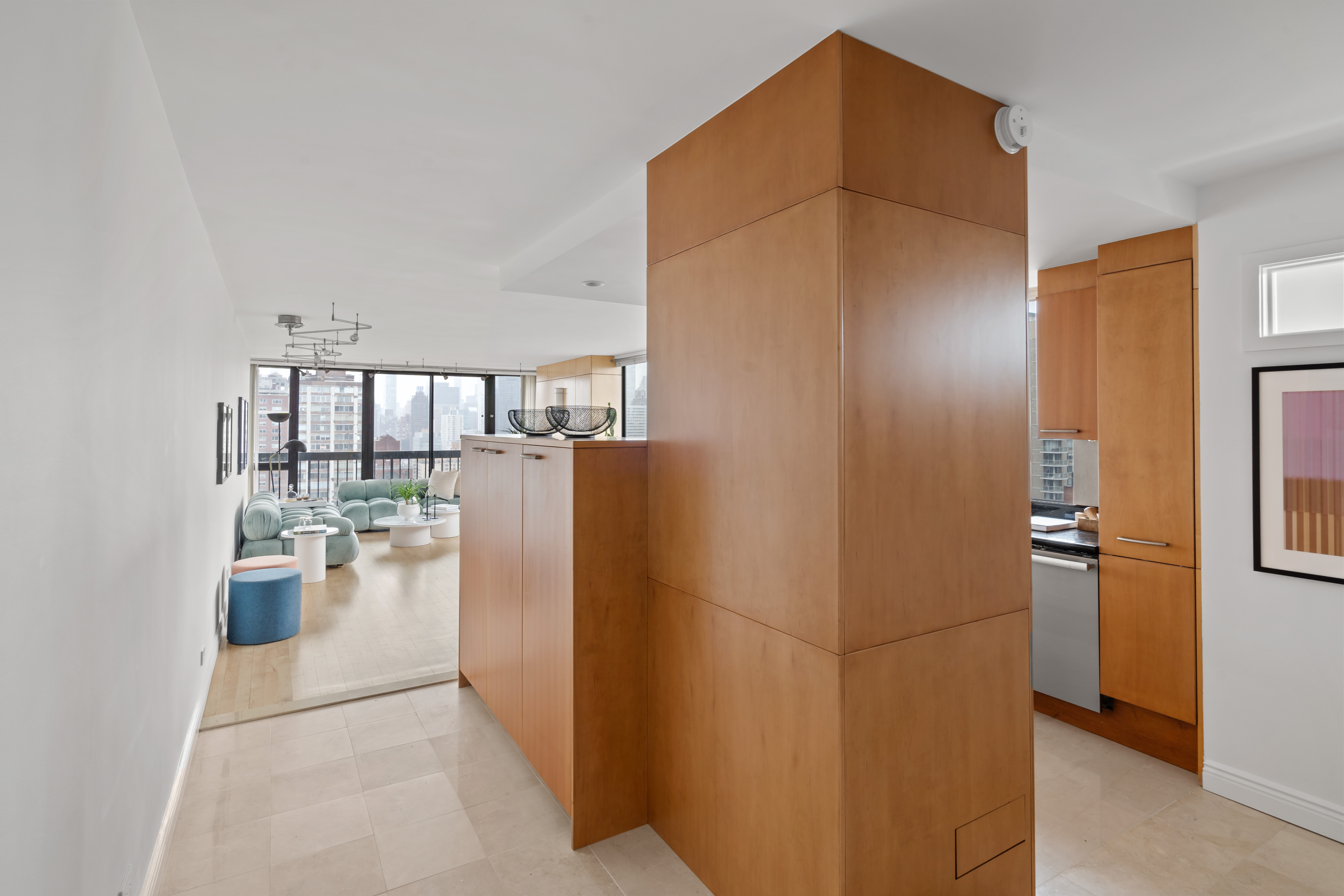 330 East 75th Street, Unit 32A Manhattan, NY 10021 - Photo 7 of 17 a kitchen with refrigerator and cabinets