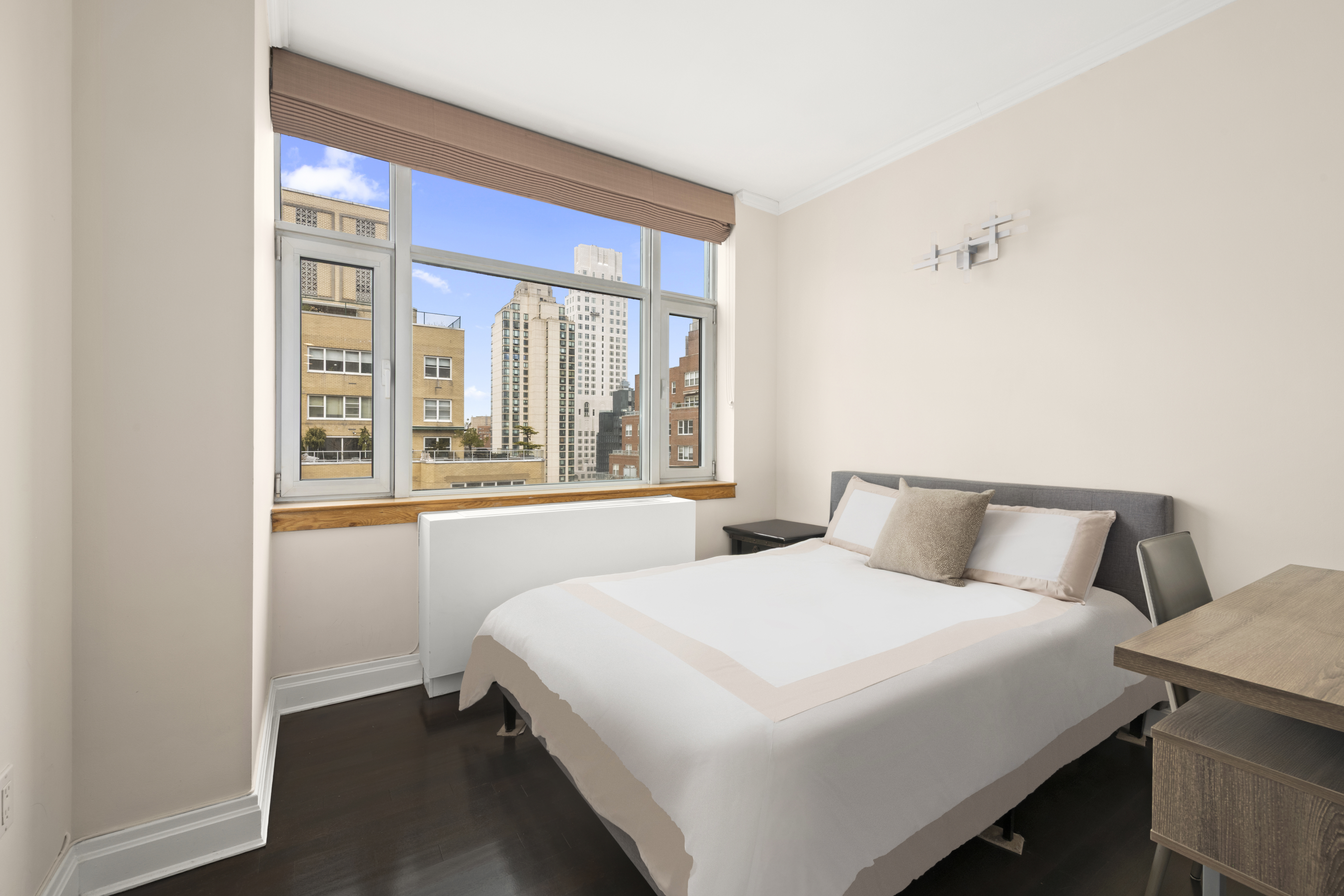 404 East 76th Street, Unit 17A Manhattan, NY 10021 - Photo 11 of 18 a bedroom with a bed and a window