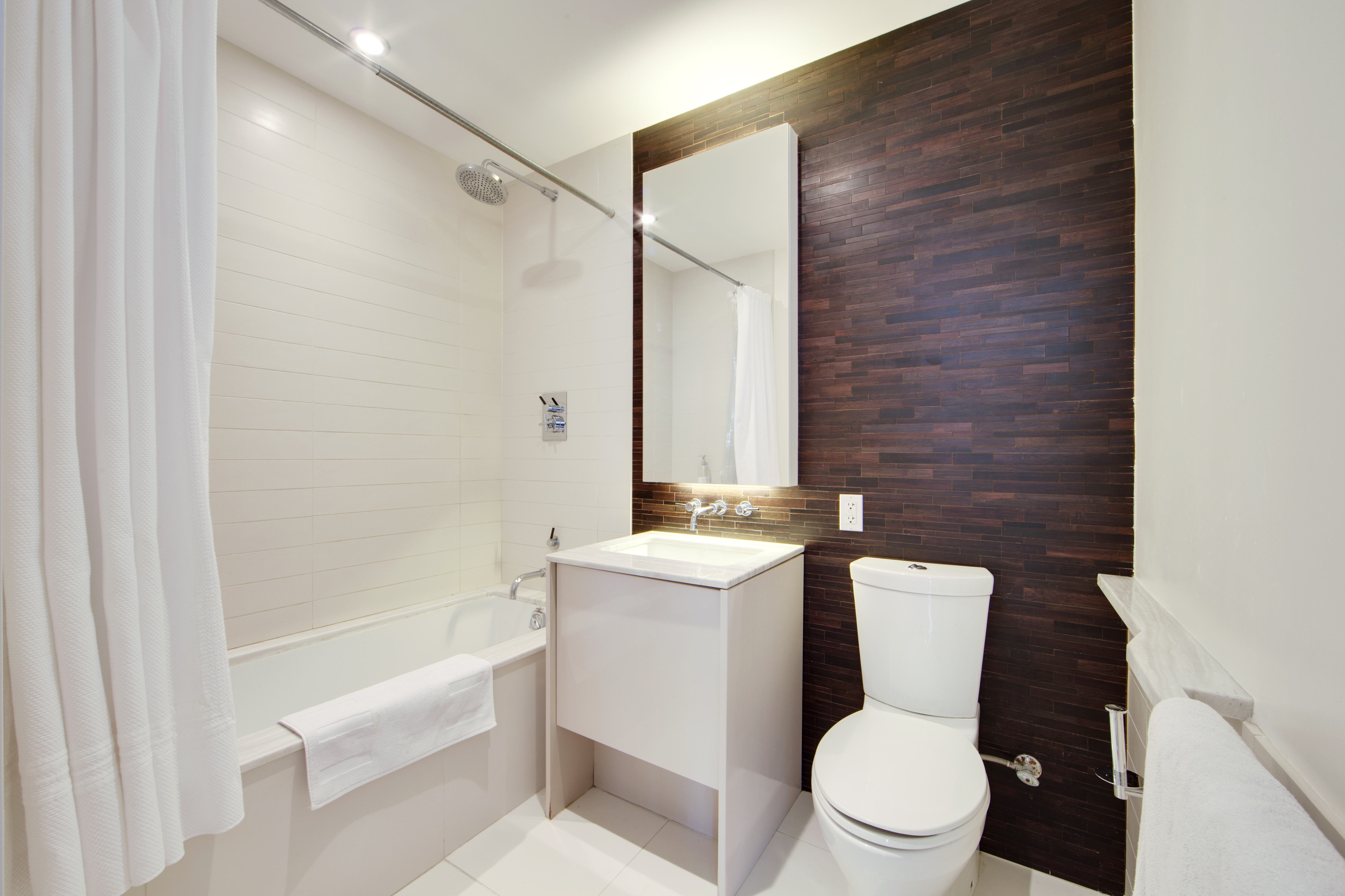 2 Northside Piers, Unit 2I Brooklyn, NY 11249 - Photo 5 of 12 a bathroom with a toilet a sink and bathtub