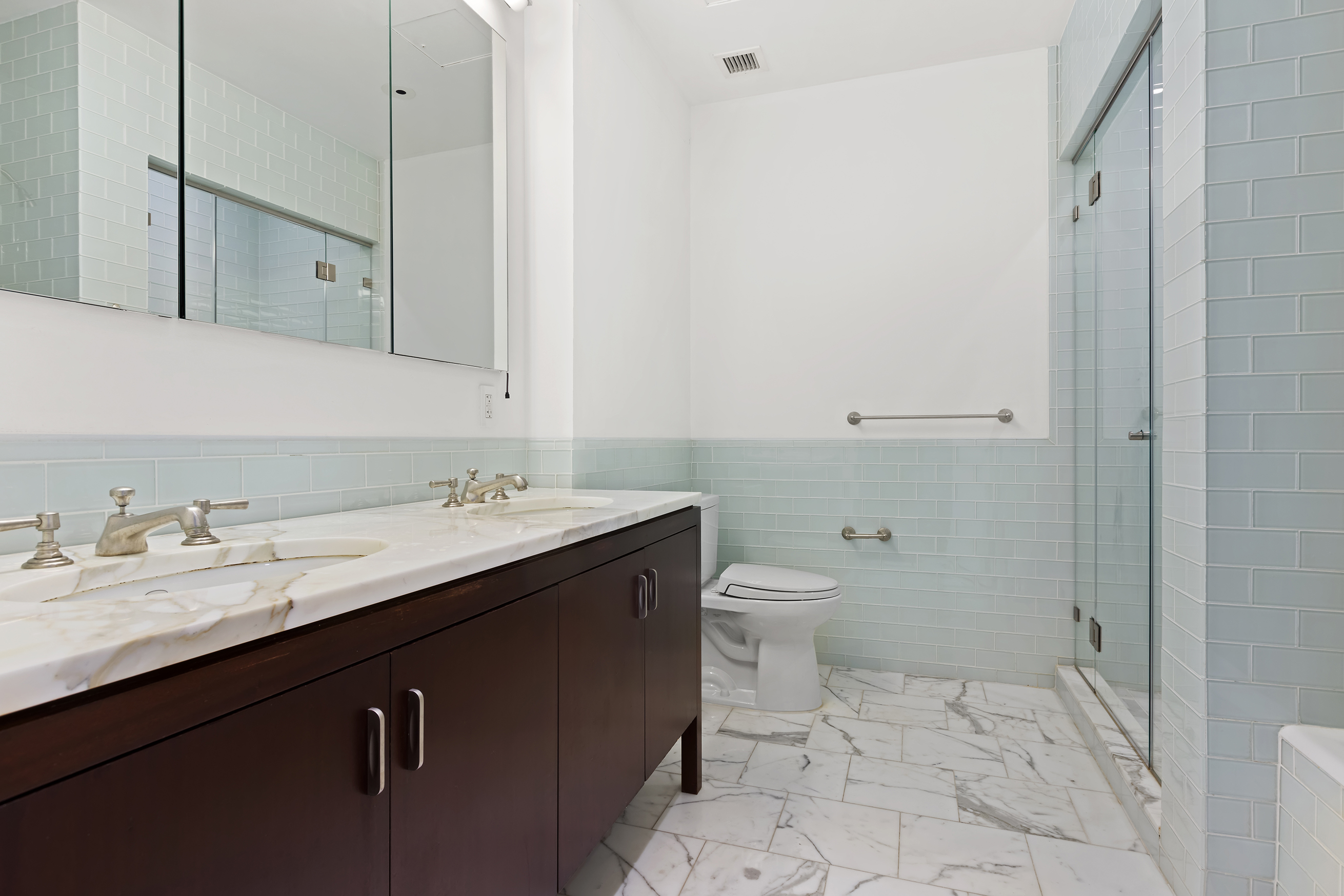 34 Leonard Street, Unit PH Manhattan, NY 10013 - Photo 12 of 30 a bathroom with a granite countertop sink a toilet and a mirror