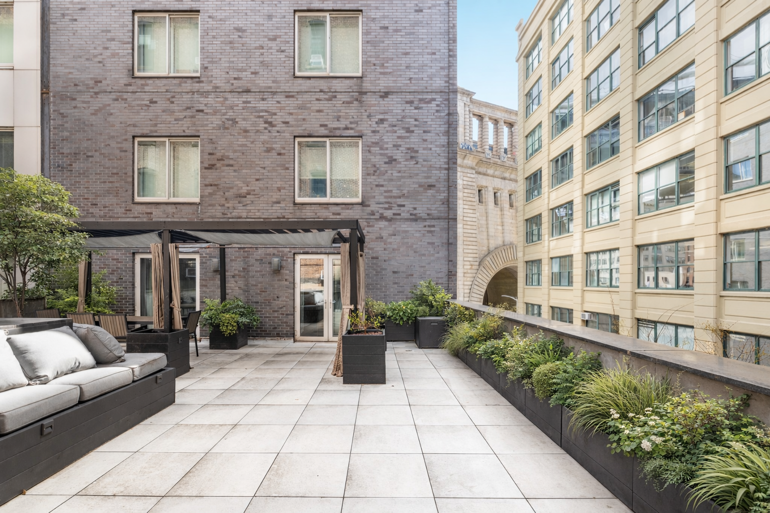 133 Water Street, Unit 4E Brooklyn, NY 11201 - Photo 15 of 21 a view of a building with potted plants and a pathway