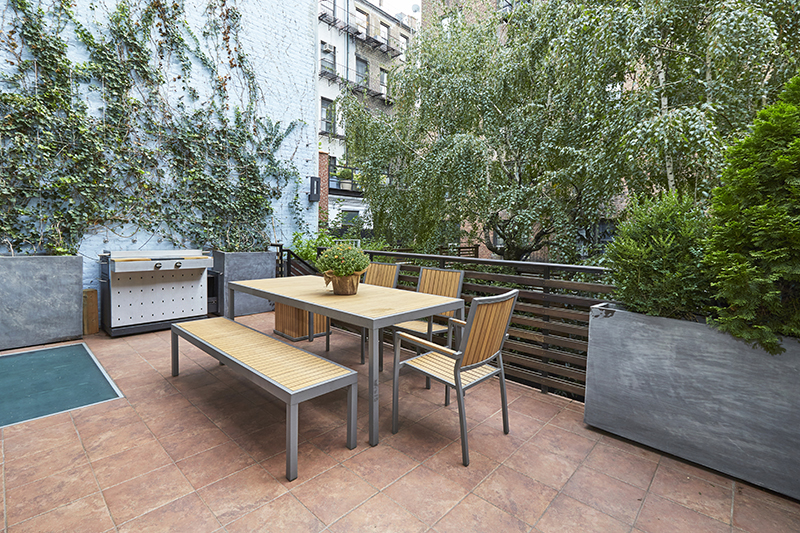 308 West 19th Street, Unit GARDEN Manhattan, NY 10011 - Photo 9 of 18 a view of a backyard with sitting area