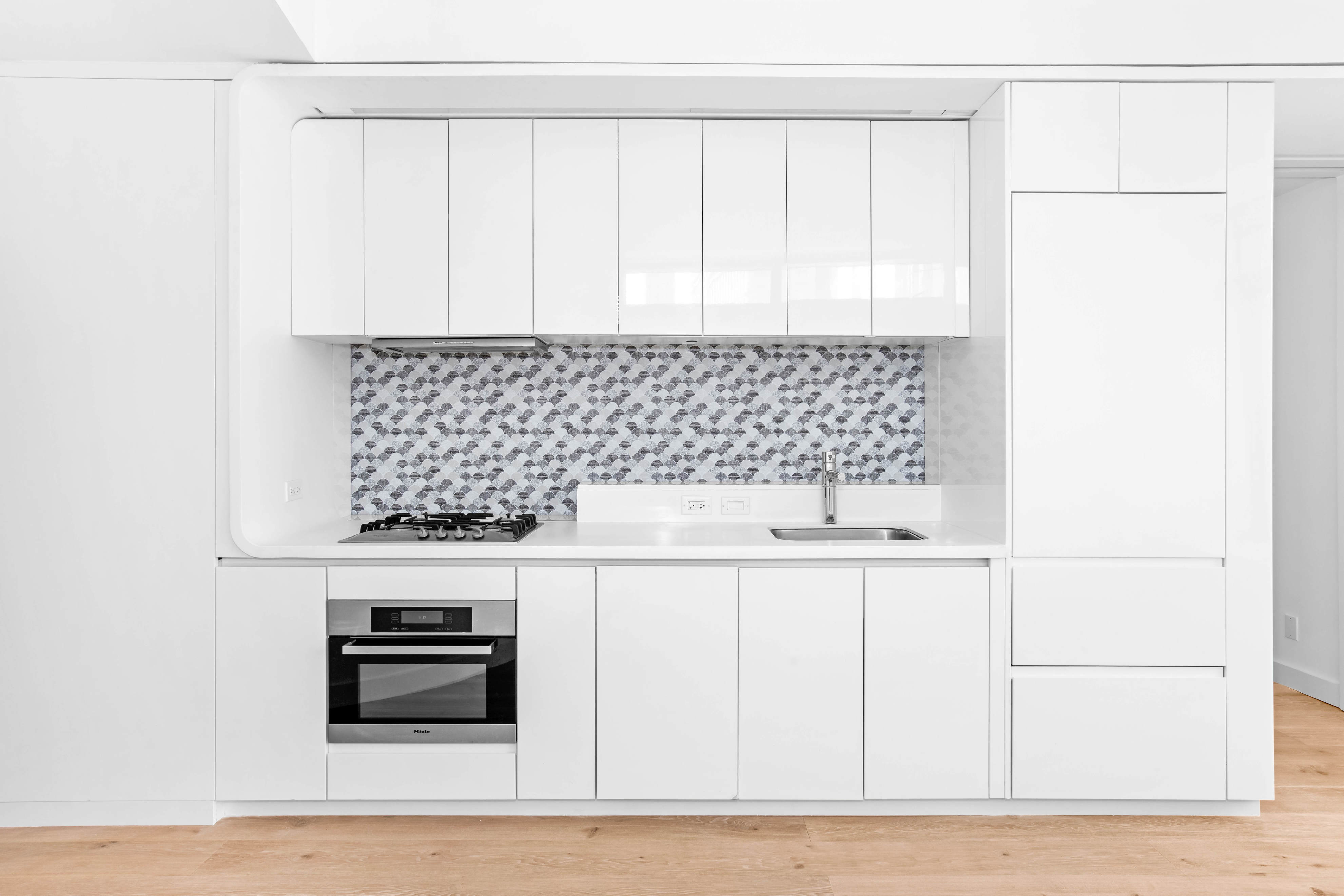 123 Washington Street, Unit 30F Manhattan, NY 10006 - Photo 4 of 11 a kitchen with a sink cabinets and appliances