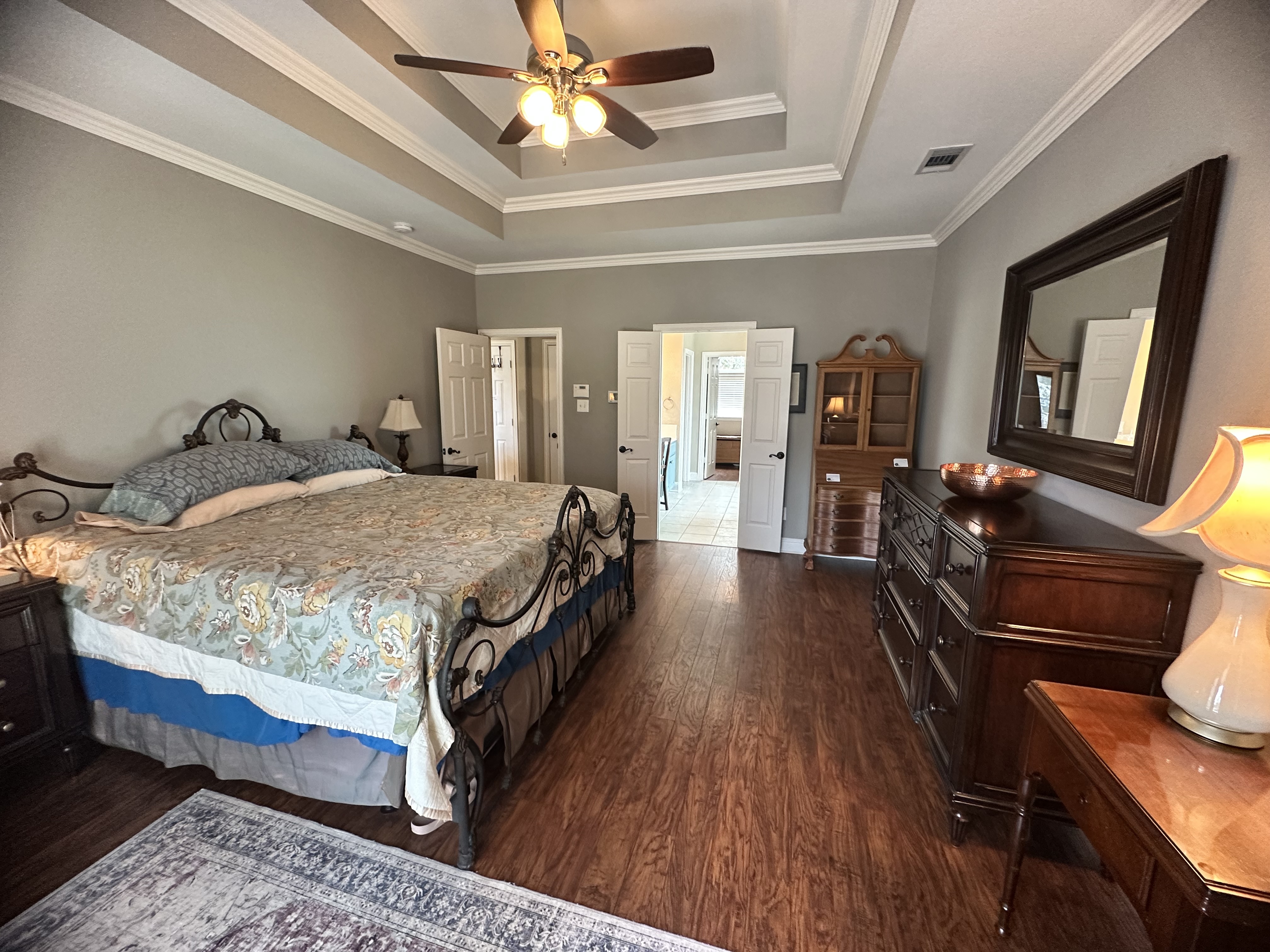 3588 Heritage Trail Celina, TX 75009 - Photo 16 of 19 a bedroom with a bed mirror on desk and a window