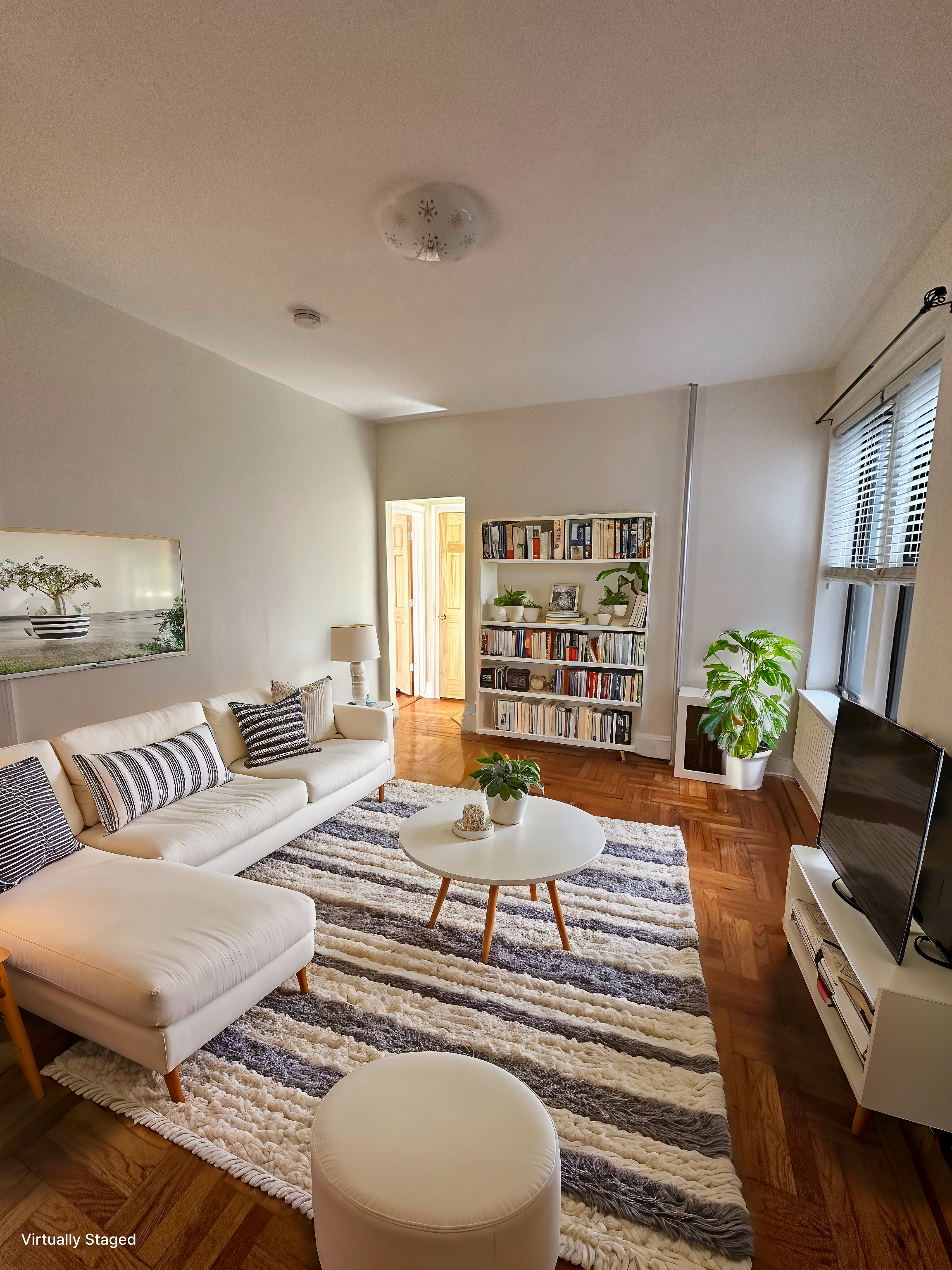 31-40 42nd Street, Unit 1F Queens, NY 11103 - Photo 1 of 9 a living room with furniture and a rug
