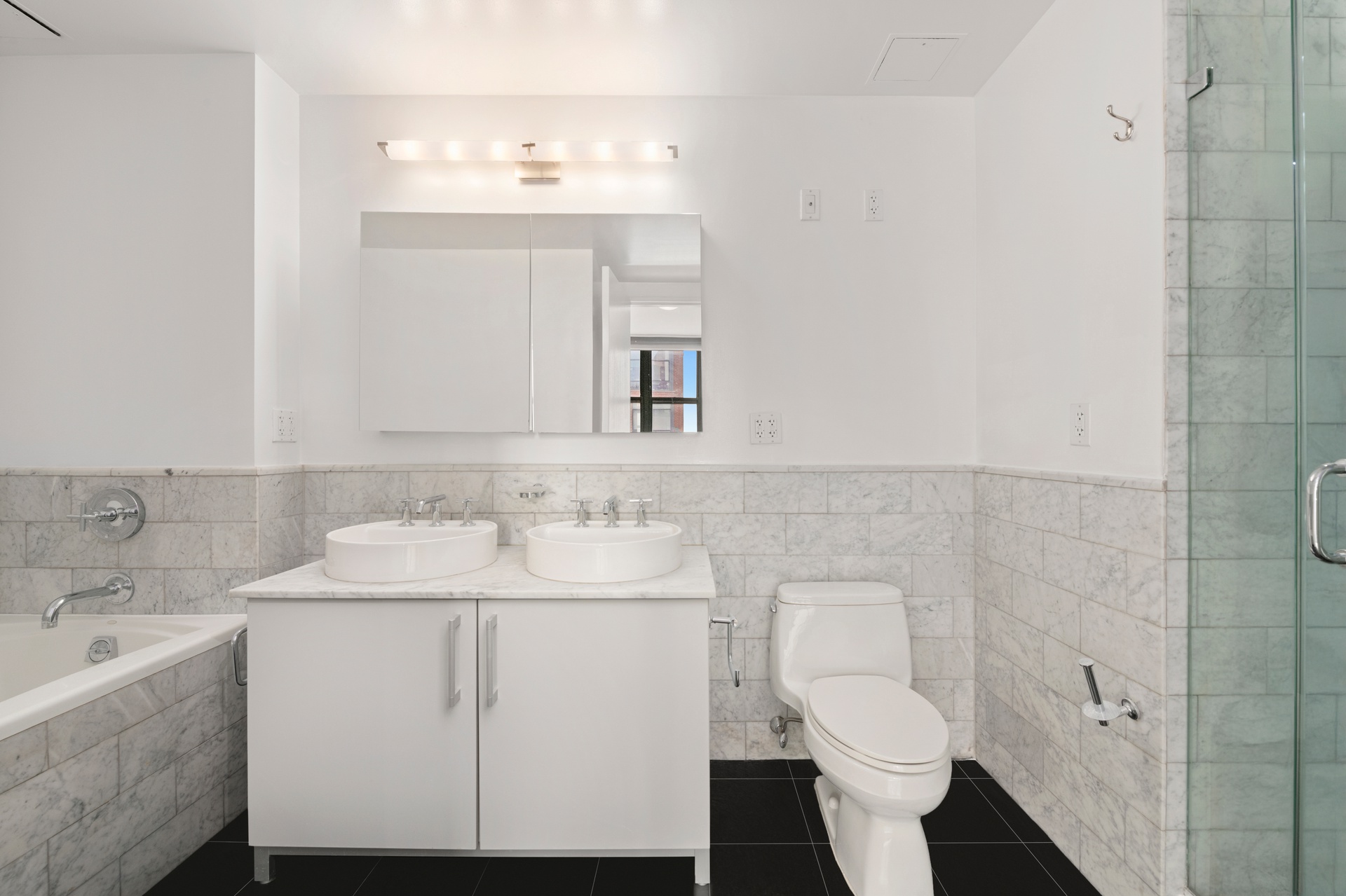 199 State Street, Unit PHD Brooklyn, NY 11201 - Photo 7 of 11 a bathroom with a sink toilet and mirror