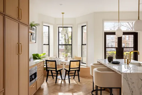 a bathroom with kitchen island a sink and a stove