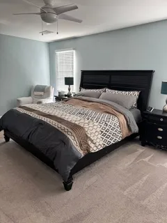 a bedroom with a bed and window