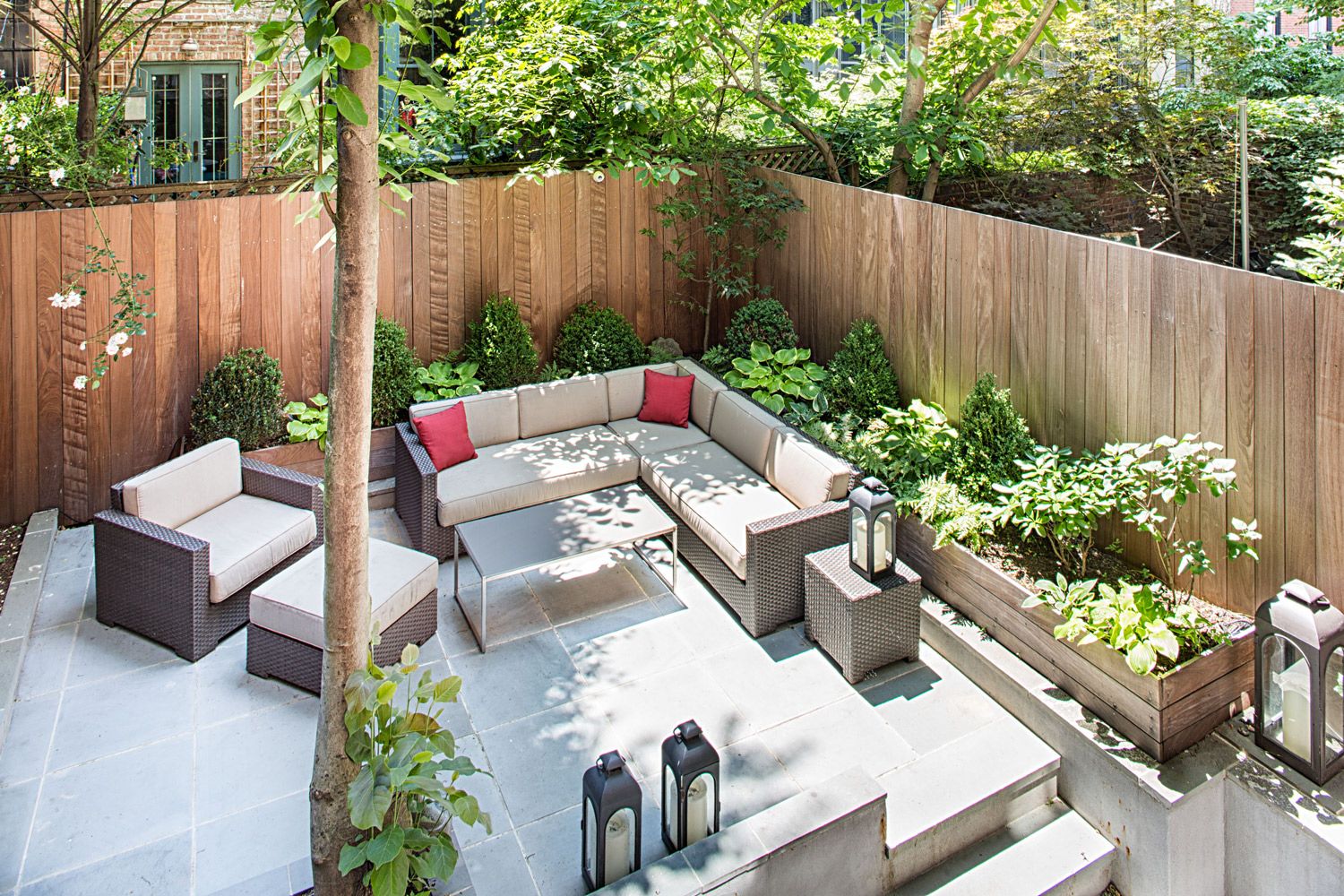 14 West 11th Street, Unit GARDEN Manhattan, NY 10011 - Photo 2 of 18 a view of outdoor sitting area with furniture and wooden fence