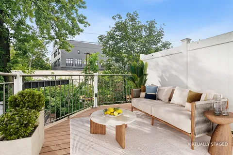 a view of sitting area with furniture and wooden deck
