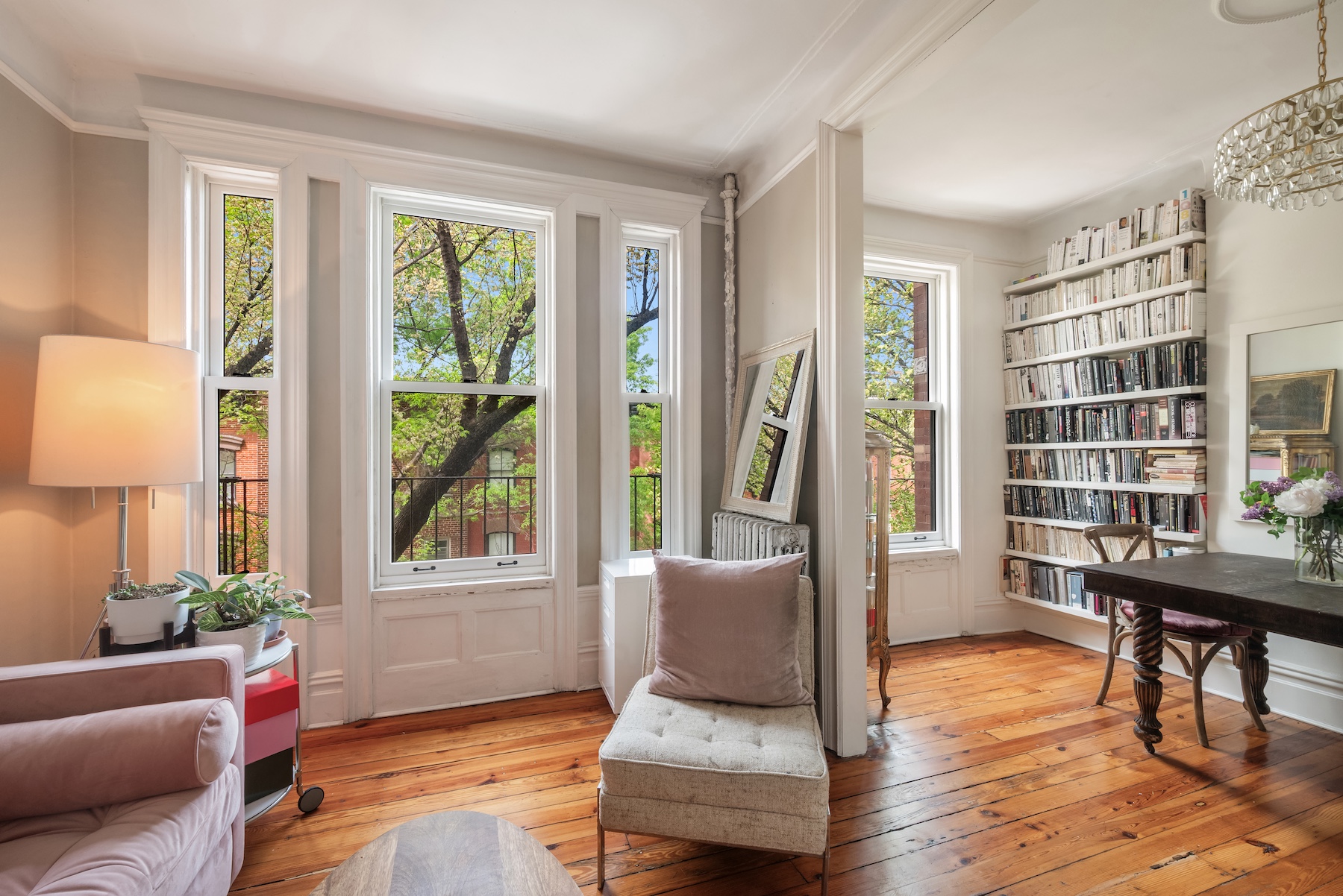 84 Charles Street, Unit 13 Manhattan, NY 10014 - Photo 2 of 8 a living room with furniture and a window