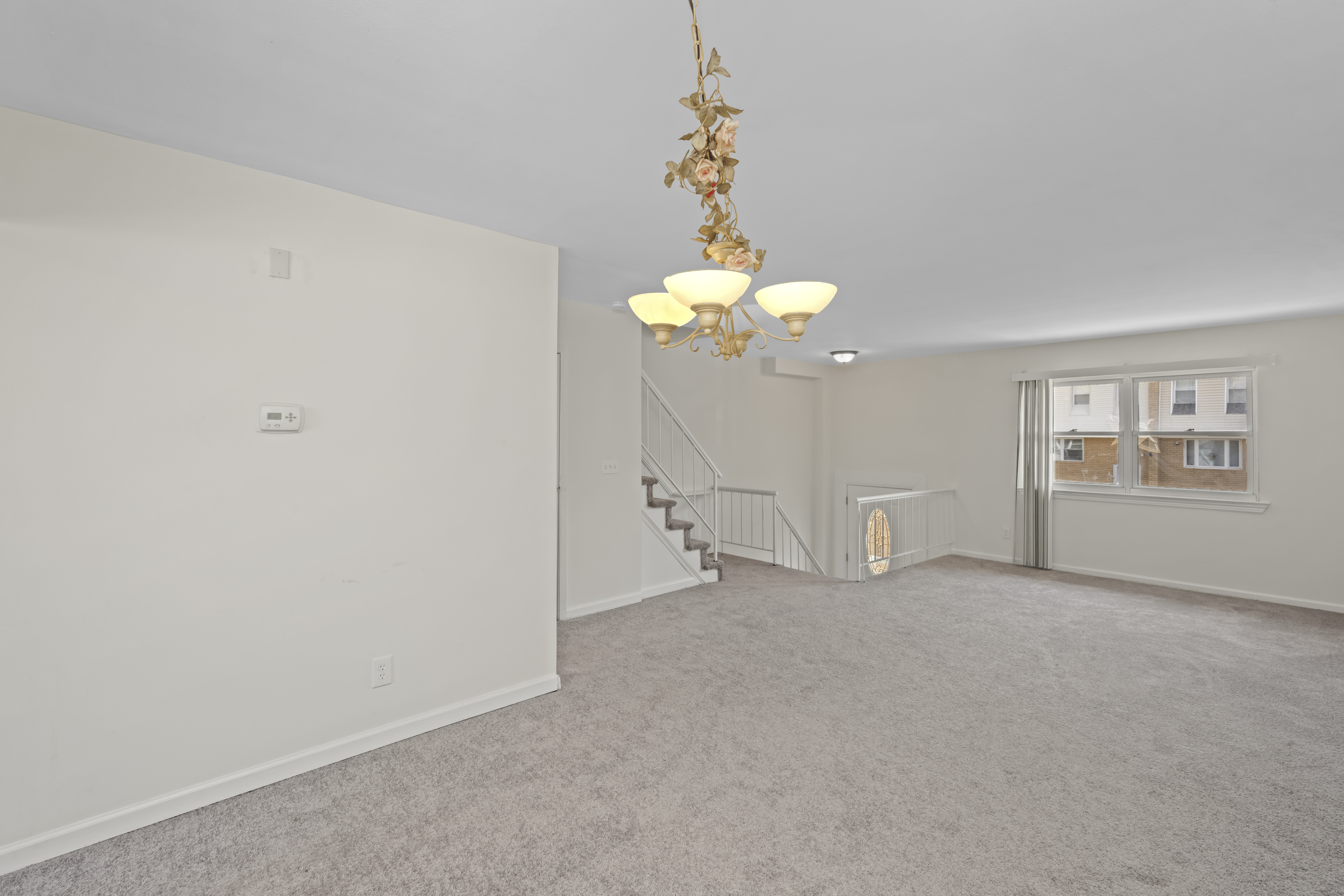 12 Yucca Drive Staten Island, NY 10312 - Photo 7 of 21 a view of an empty room with chandelier