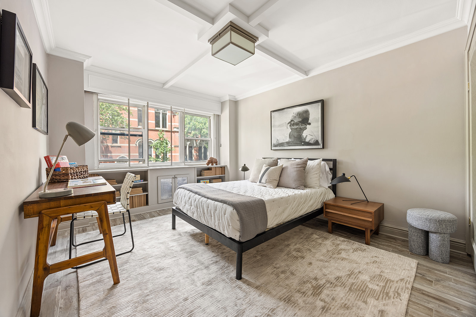 69 West 9th Street, Unit 2B Manhattan, NY 10011 - Photo 11 of 18 a spacious bedroom with a bed and a window
