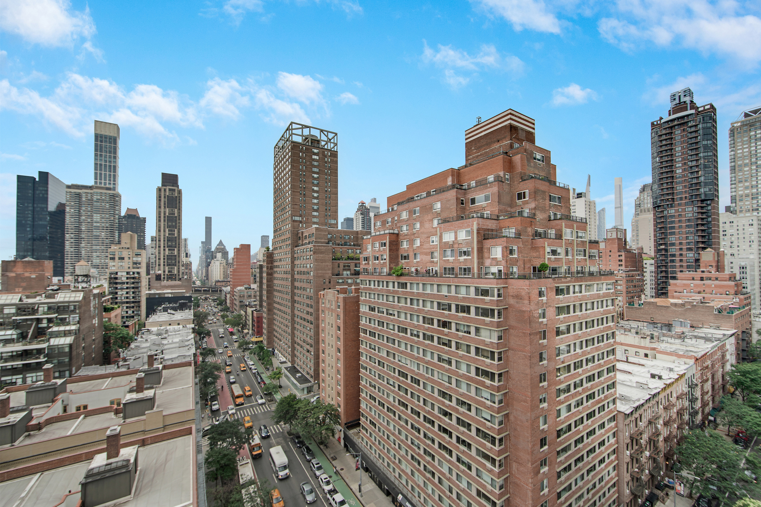 401 East 65th Street, Unit 16C Manhattan, NY 10065 - Photo 12 of 13 a view of a city with tall buildings
