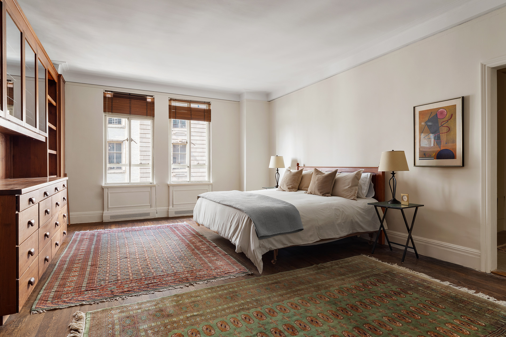 145-146 Central Park West, Unit 8C Manhattan, NY 10023 - Photo 12 of 17 a spacious bedroom with a bed a couch and windows