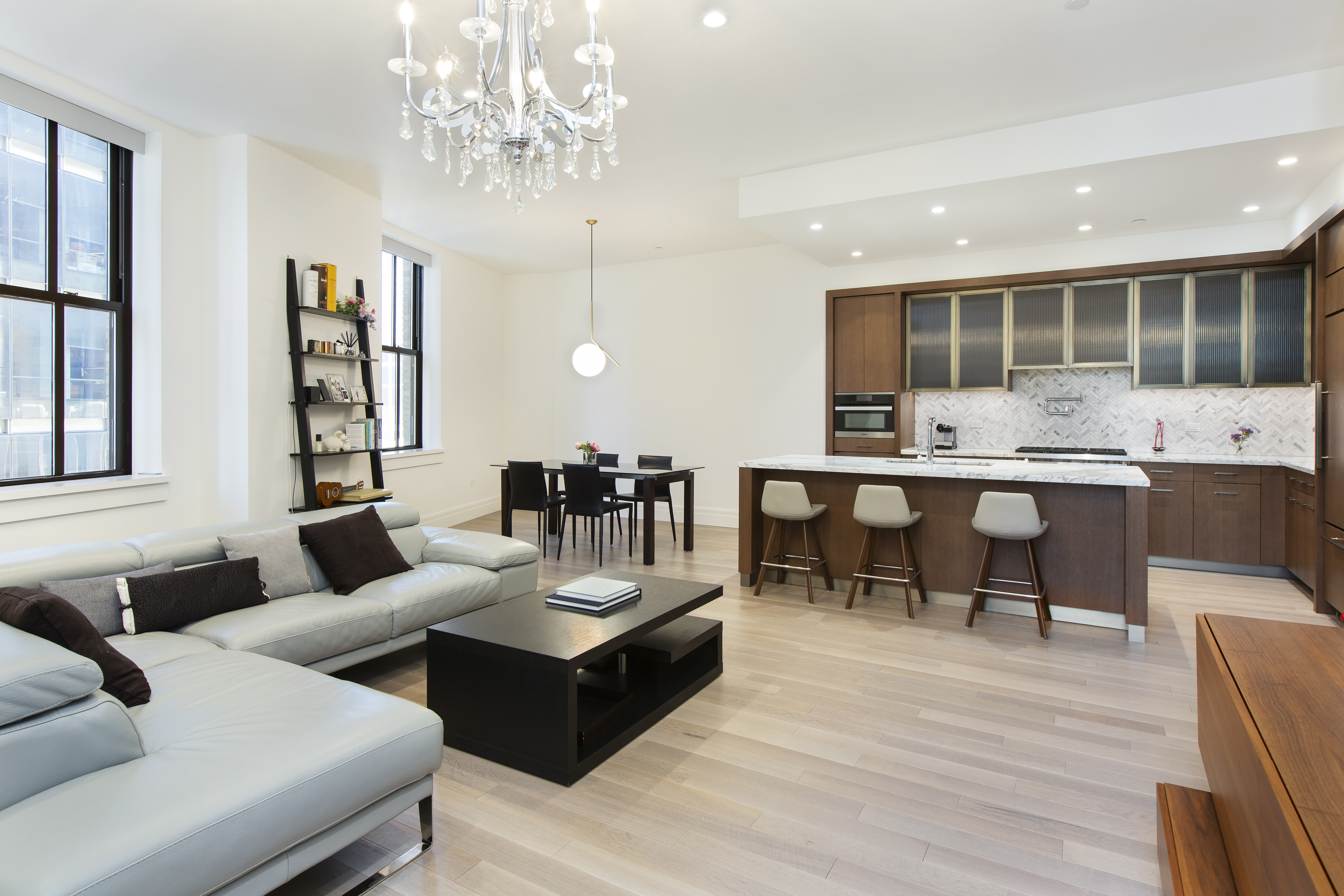 100 Barclay Street, Unit 14K Manhattan, NY 10007 - Photo 1 of 9 a living room with furniture and a large window