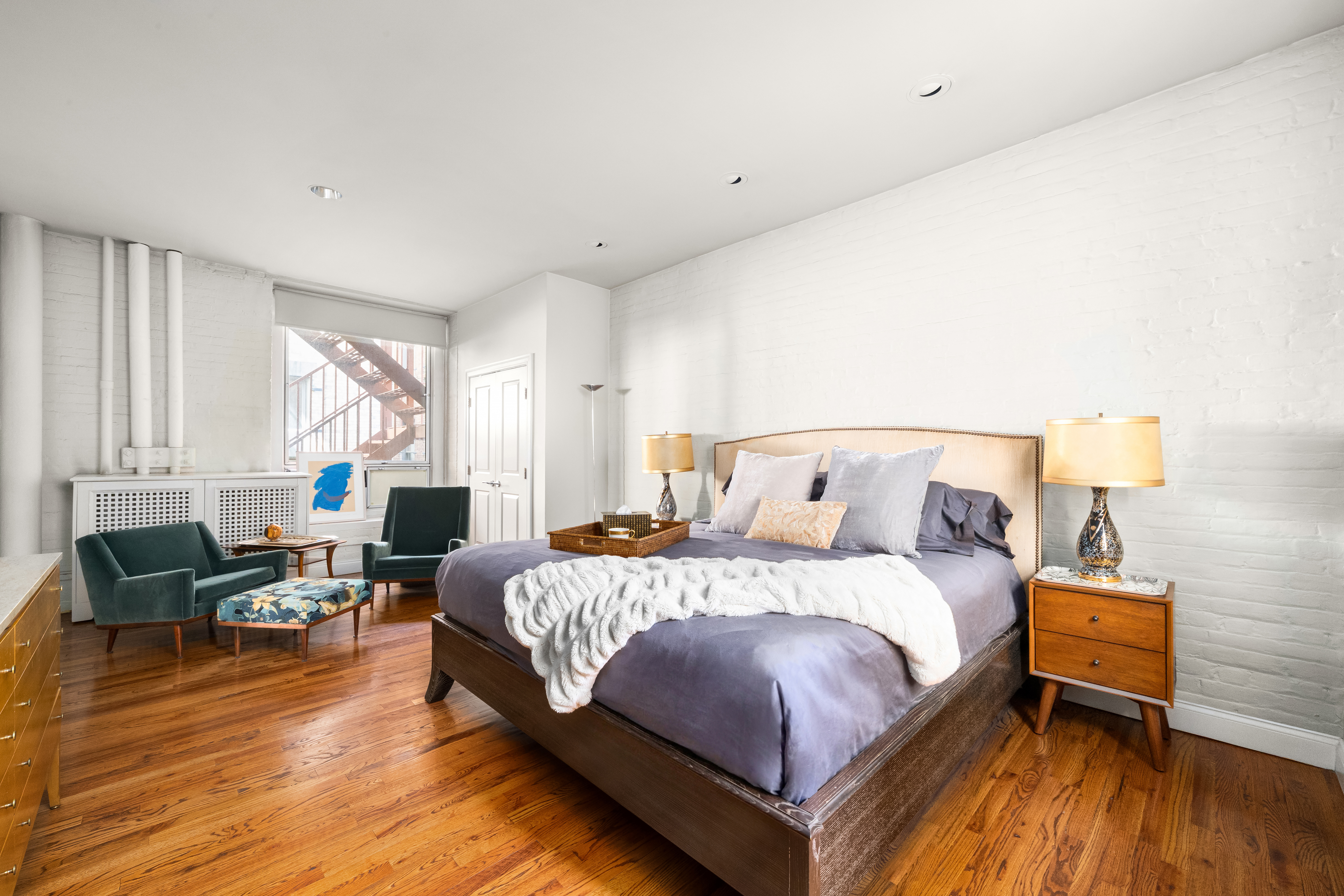 20-26 North Moore Street, Unit 4W Manhattan, NY 10013 - Photo 11 of 24 a bedroom with a bed and wooden floor