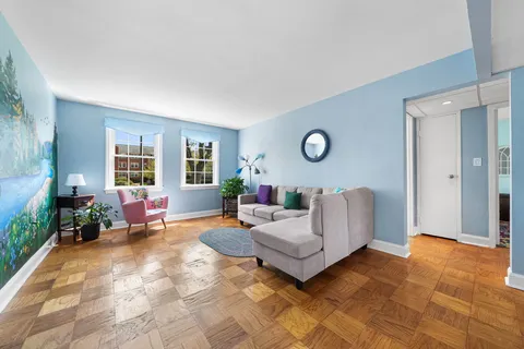 a living room with furniture and a window