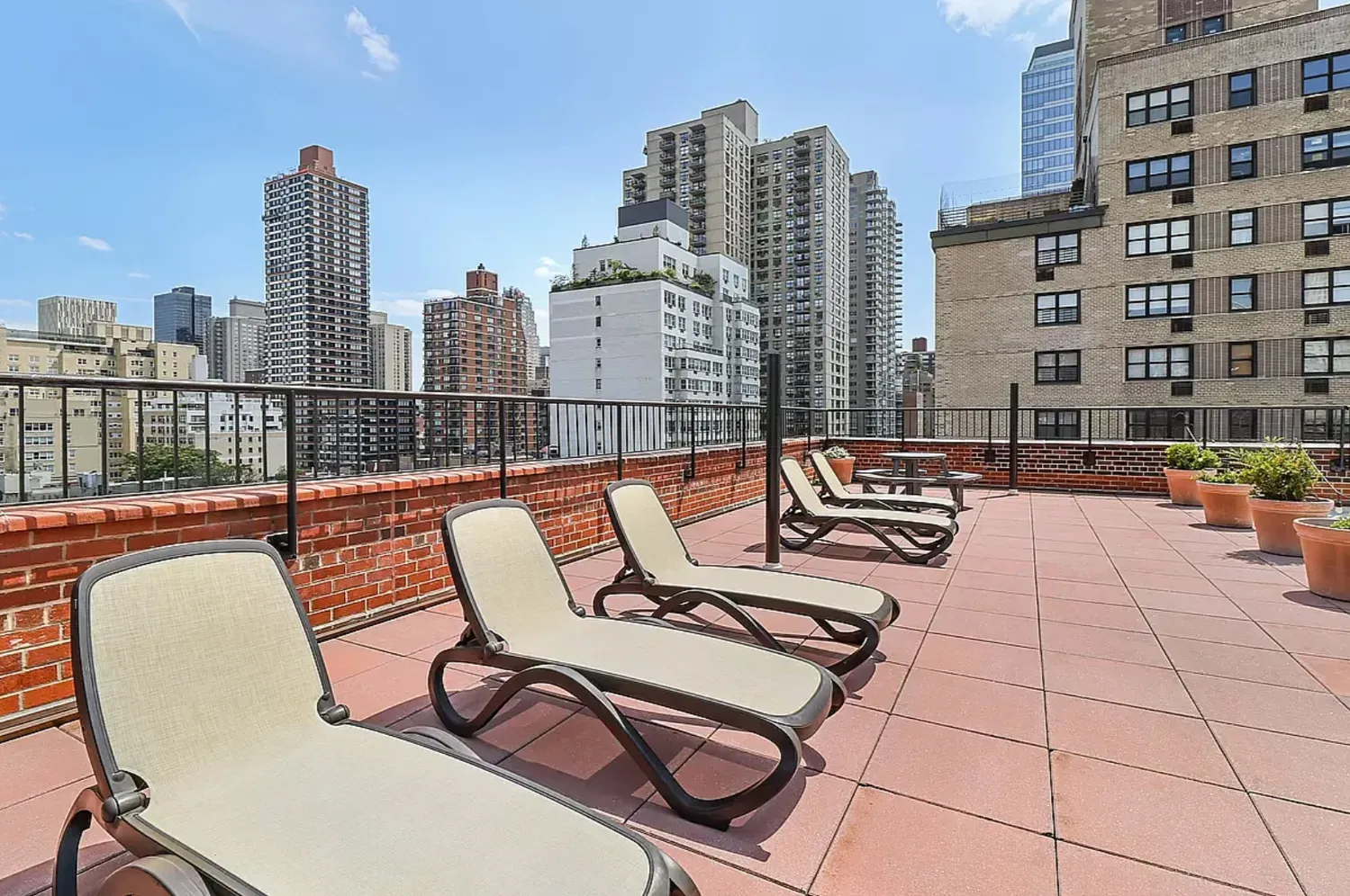 a swimming pool with outdoor seating and city view