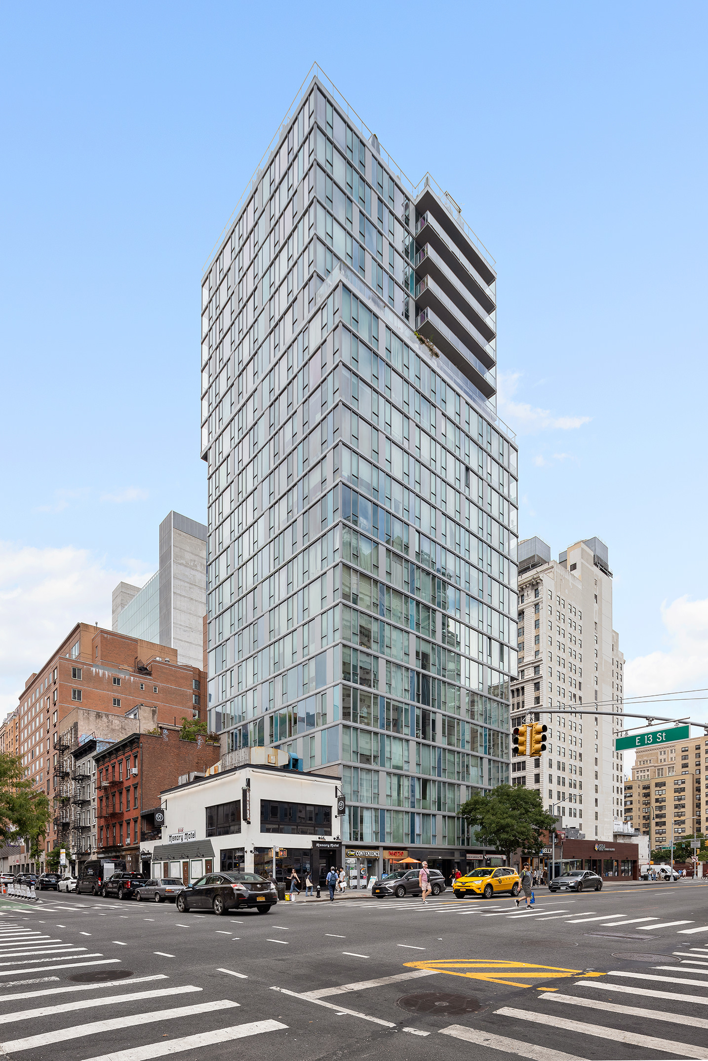 110 3rd Avenue, Unit 4B Manhattan, NY 10003 - Photo 14 of 15 a tall building sitting on the side of a street
