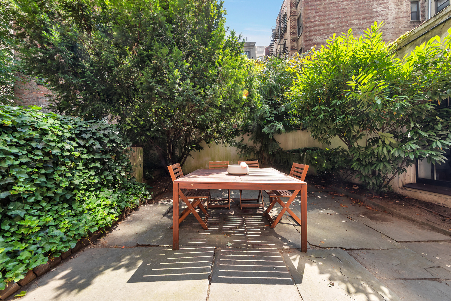 206 East 30th Street Manhattan, NY 10016 - Photo 6 of 17 a view of a chairs and table on the patio