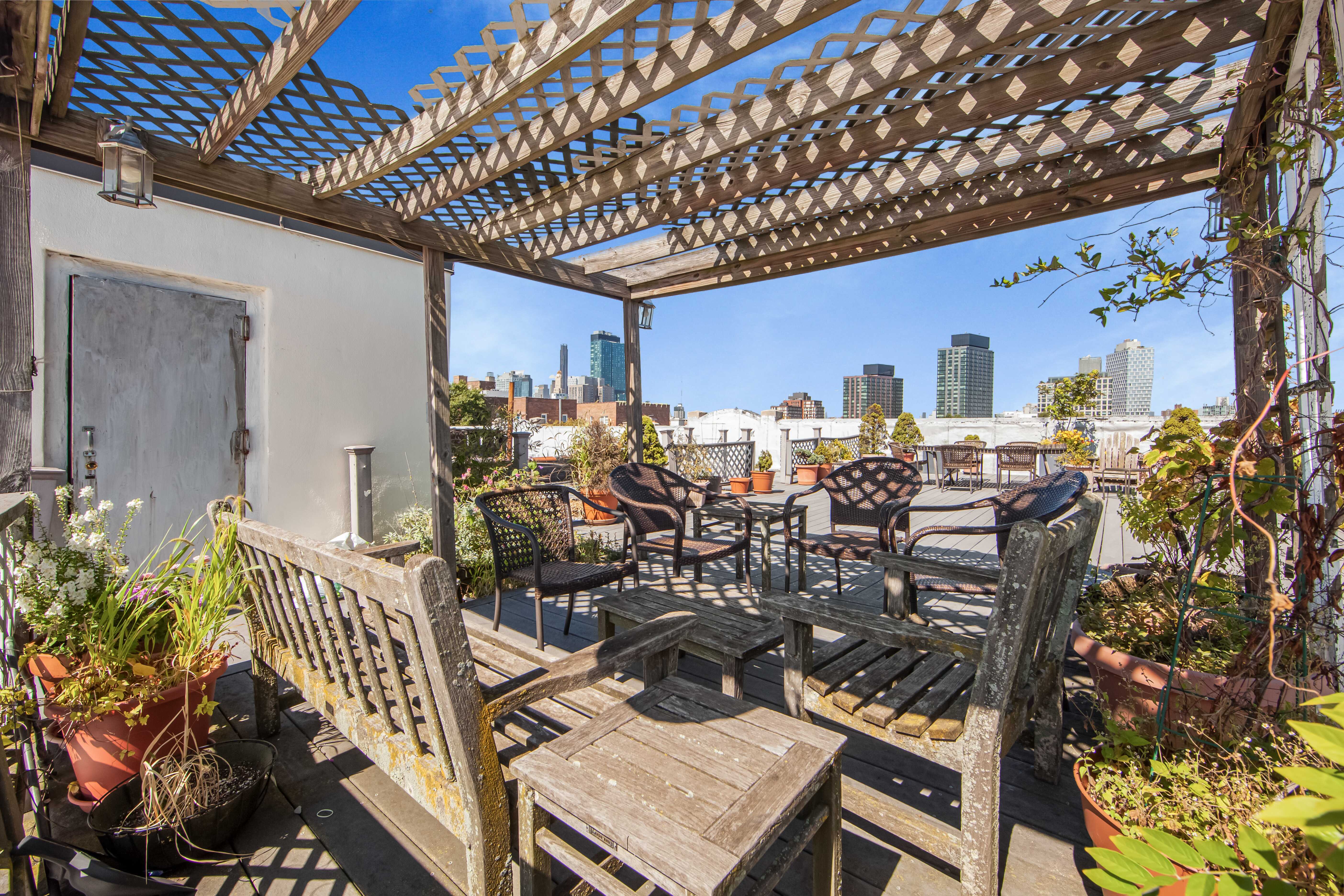 254 Park Place, Unit 4B Brooklyn, NY 11238 - Photo 10 of 12 a terrace with outdoor seating and wooden floor