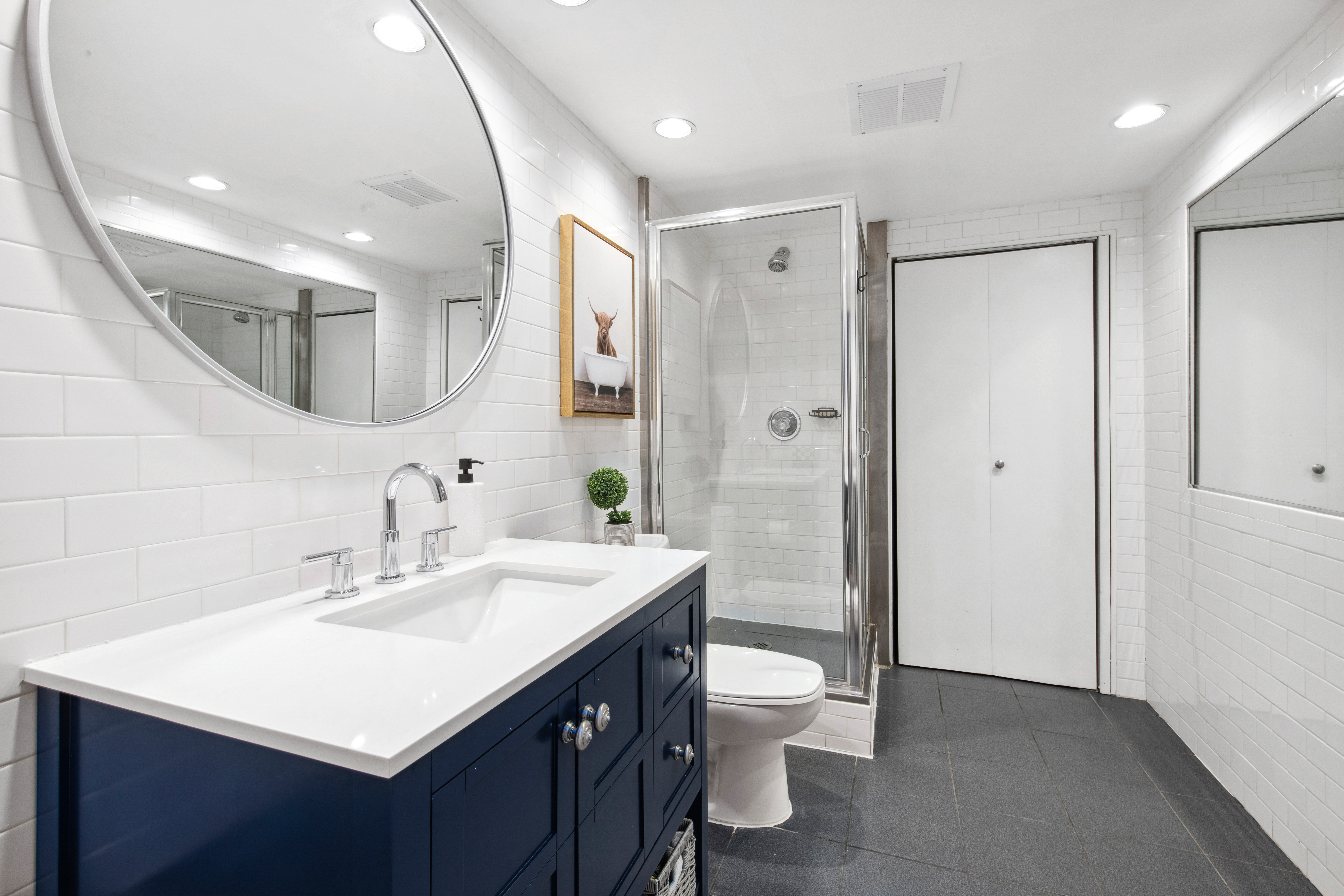 112 West 18th Street, Unit 2A Manhattan, NY 10011 - Photo 9 of 10 a bathroom with a sink a toilet and shower