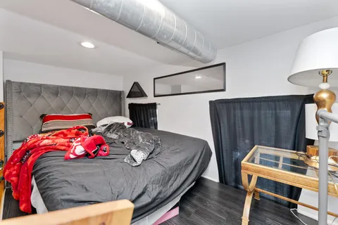 a living room with furniture kitchen view and a table
