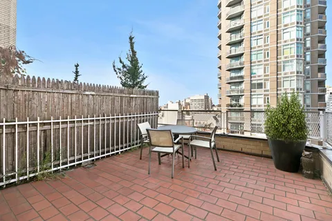 a view of balcony with furniture