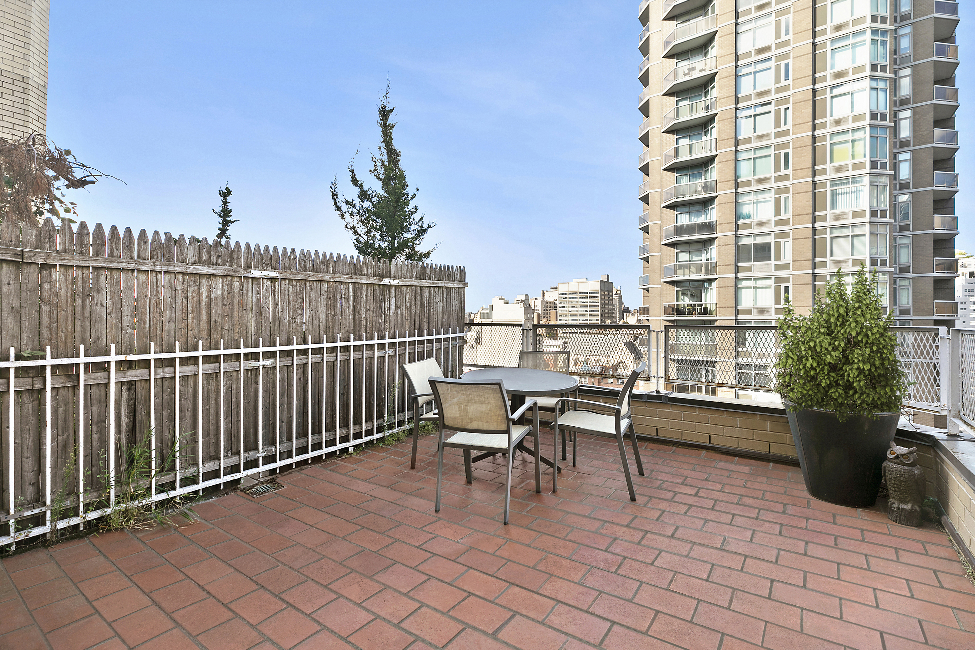 166 East 63rd Street, Unit 18B Manhattan, NY 10065 - Photo 10 of 12 a view of balcony with furniture