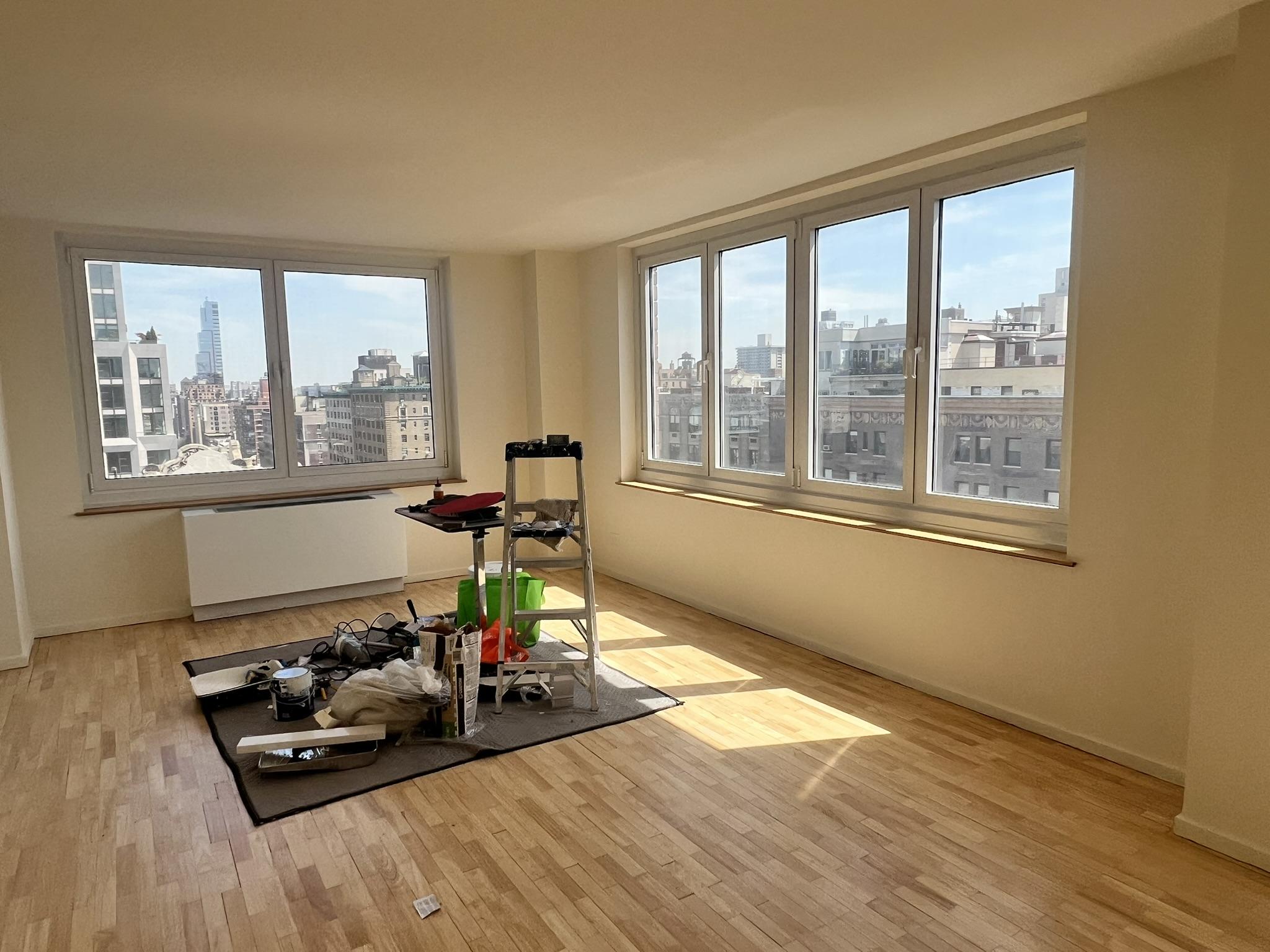 250 West 90th Street, Unit PH2F Manhattan, NY 10024 - Photo 9 of 21 a living room with furniture and a large window