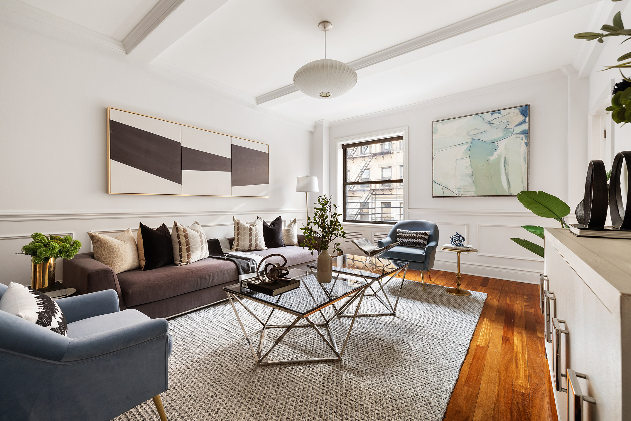 203 West 81st Street, Unit 3A Manhattan, NY 10024 - Photo 2 of 12 a living room with furniture and a flat screen tv