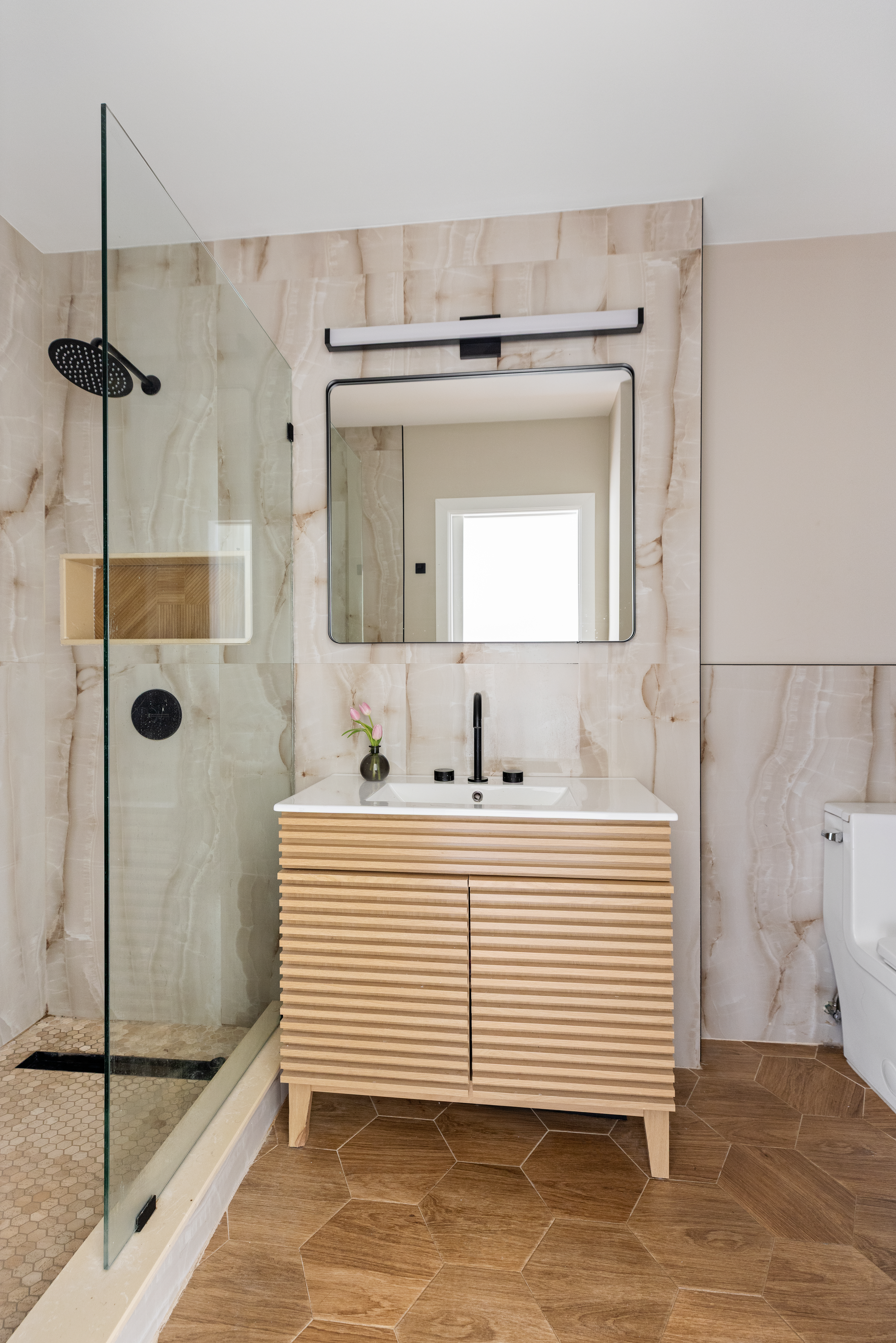 663 Greene Avenue Brooklyn, NY 11221 - Photo 6 of 14 a bathroom with a sink and mirror