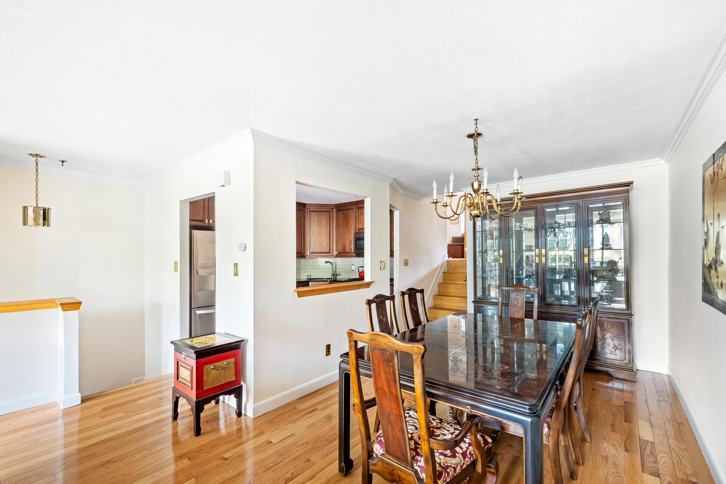 436 78th Street, Unit 5 Brooklyn, NY 11209 - Photo 4 of 10 a dining room with furniture a chandelier and wooden floor