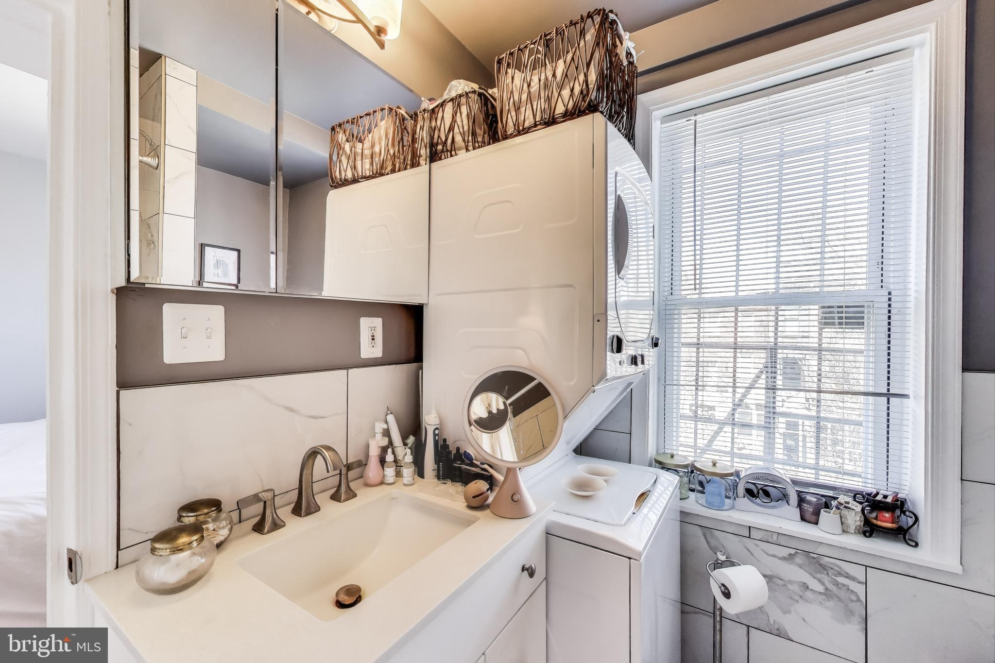 1317 Corcoran Street Northwest Washington, DC 20009 - Photo 27 of 47 a bathroom with a sink and a mirror