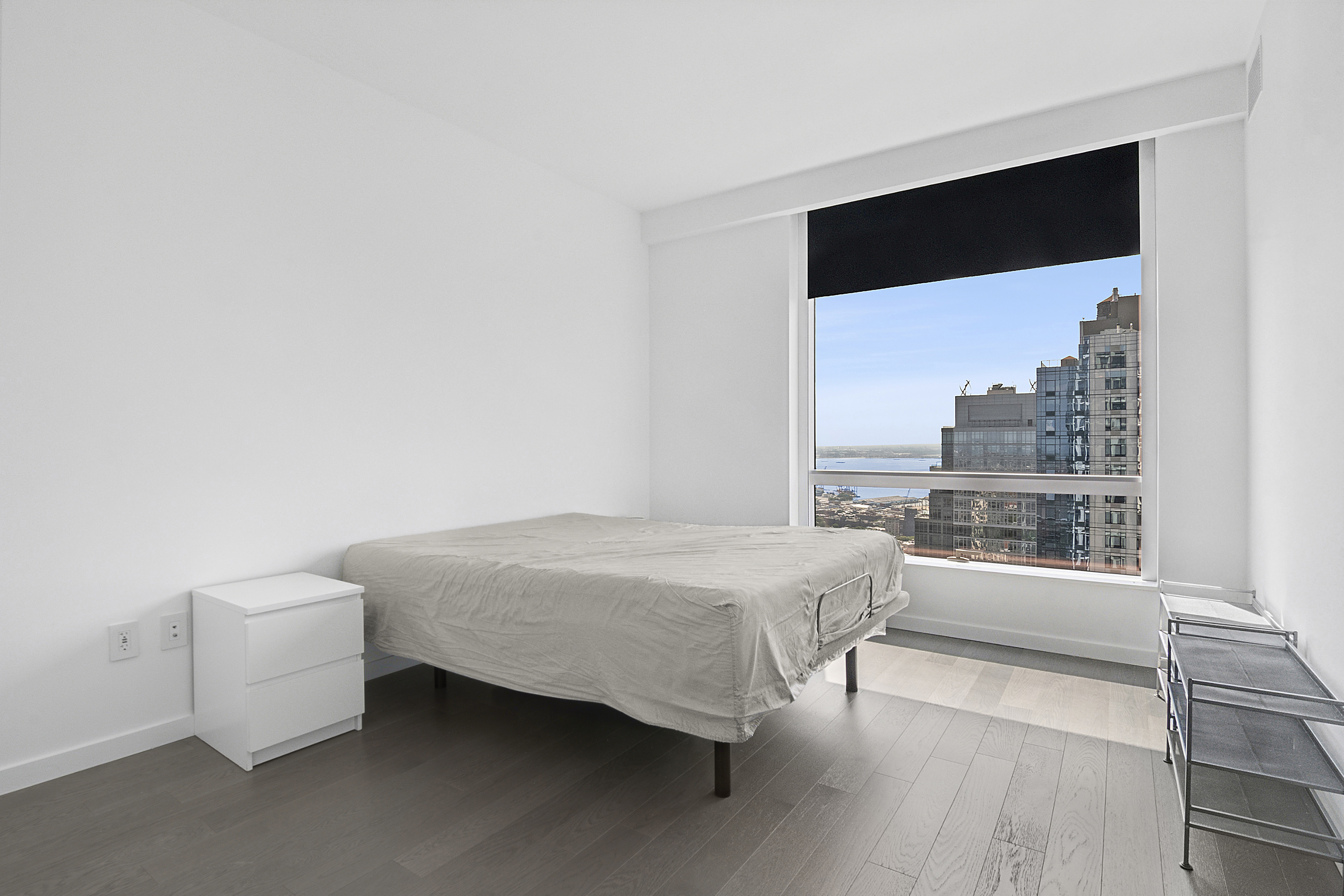 1 City Point, Unit 57A Brooklyn, NY 11201 - Photo 6 of 23 a bedroom with a bed and a large window