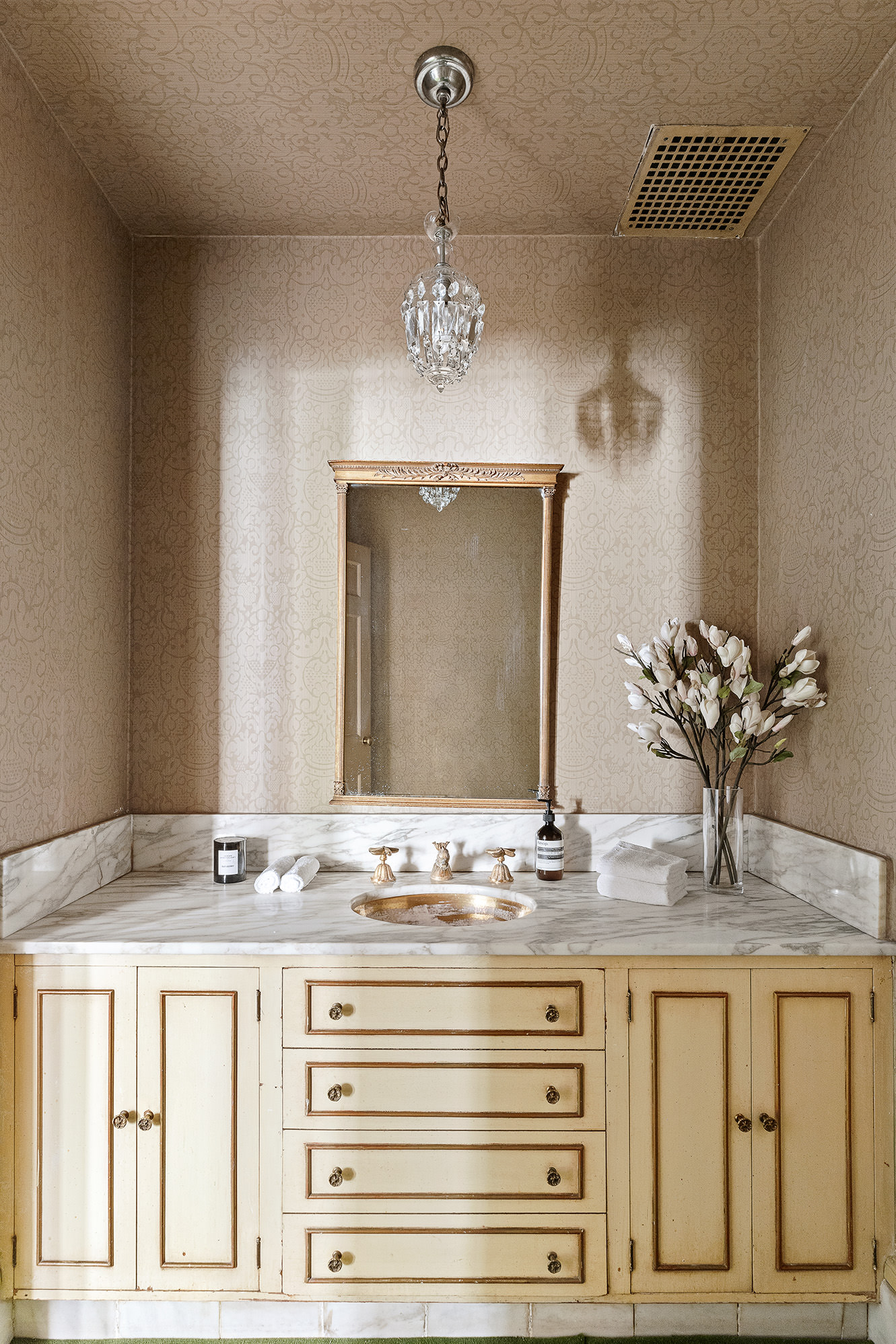 10 East 82nd Street Manhattan, NY 10028 - Photo 13 of 22 a bathroom with a granite countertop sink and a mirror